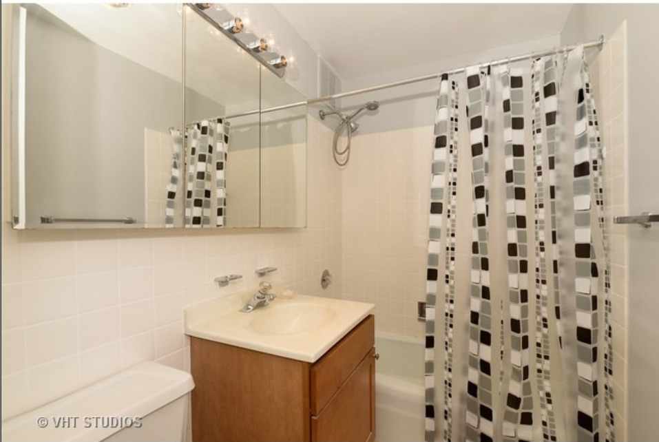 Undisclosed Address Chicago, IL 60613 - Photo 10 of 15 a bathroom with a sink toilet and shower