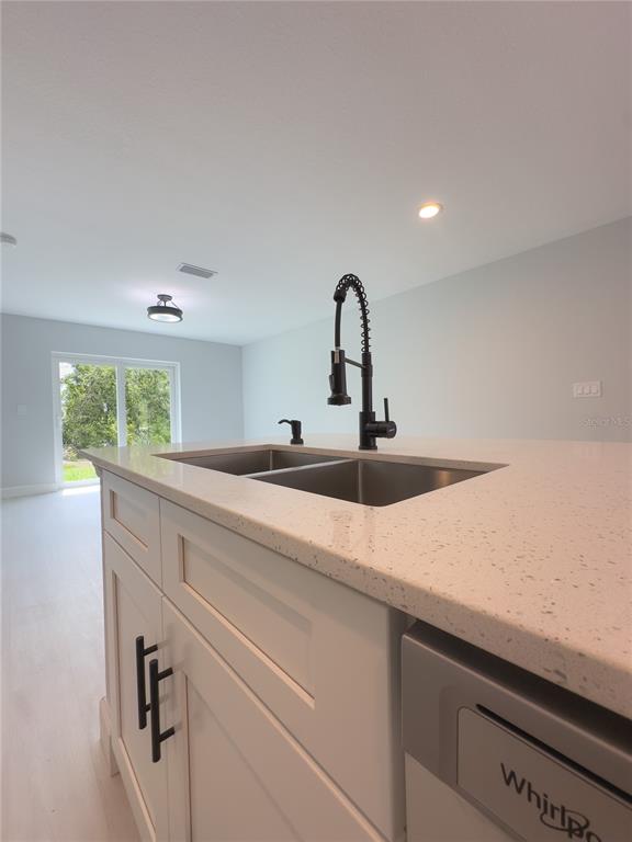 3602 Gillot Boulevard Port Charlotte, FL 33981 - Photo 11 of 28 a kitchen with a sink and a window
