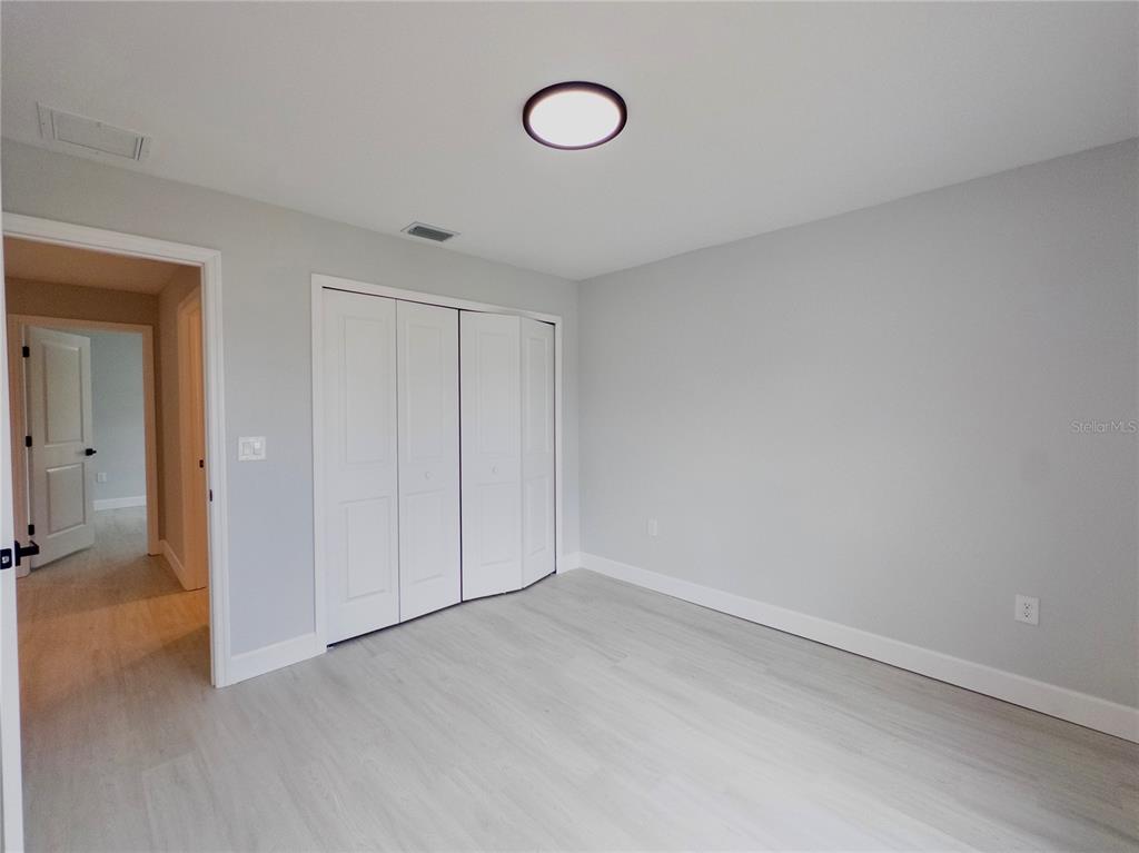 3602 Gillot Boulevard Port Charlotte, FL 33981 - Photo 20 of 28 a view of a room with rack and wooden cabinets