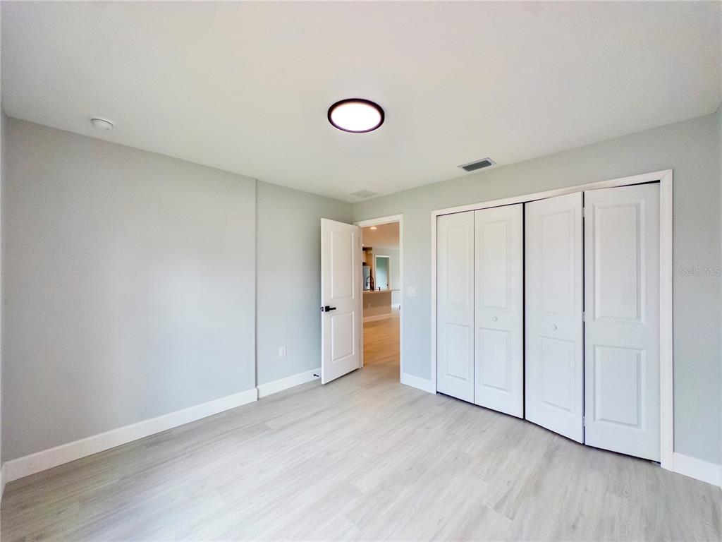 3602 Gillot Boulevard Port Charlotte, FL 33981 - Photo 21 of 28 a view of an empty room and wooden floor