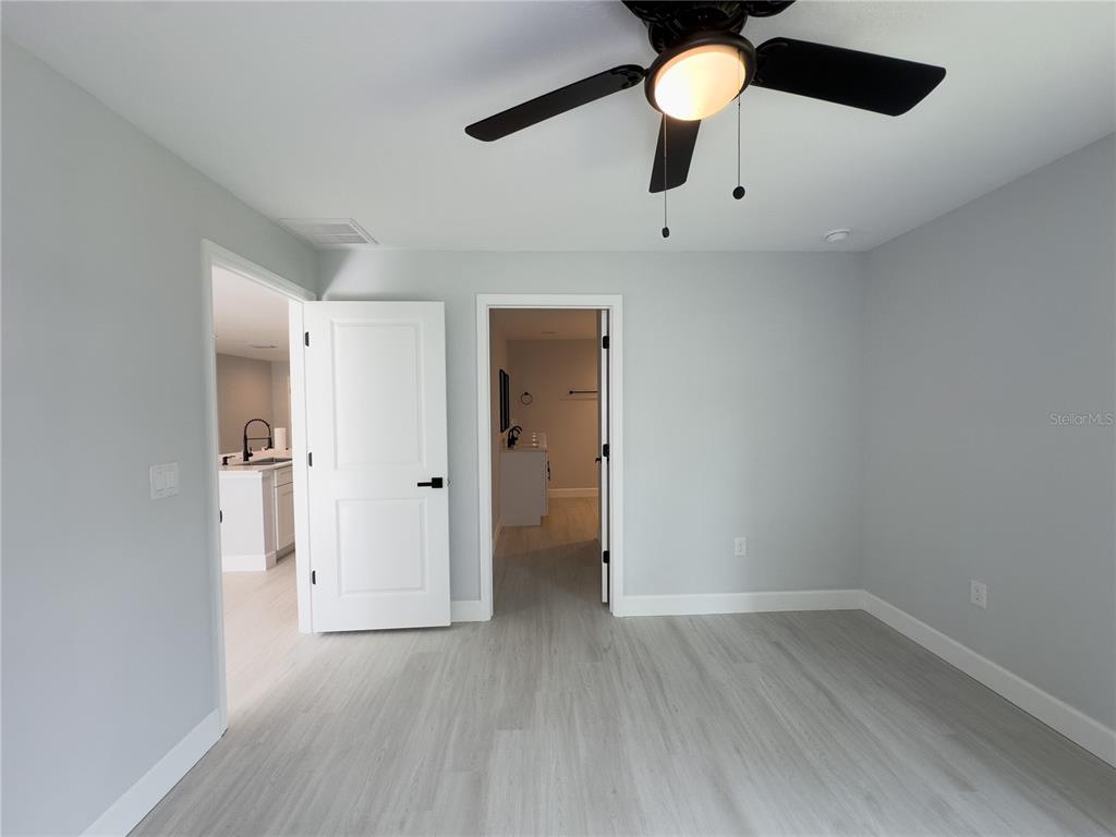 3602 Gillot Boulevard Port Charlotte, FL 33981 - Photo 23 of 28 wooden floor in an empty room with a window