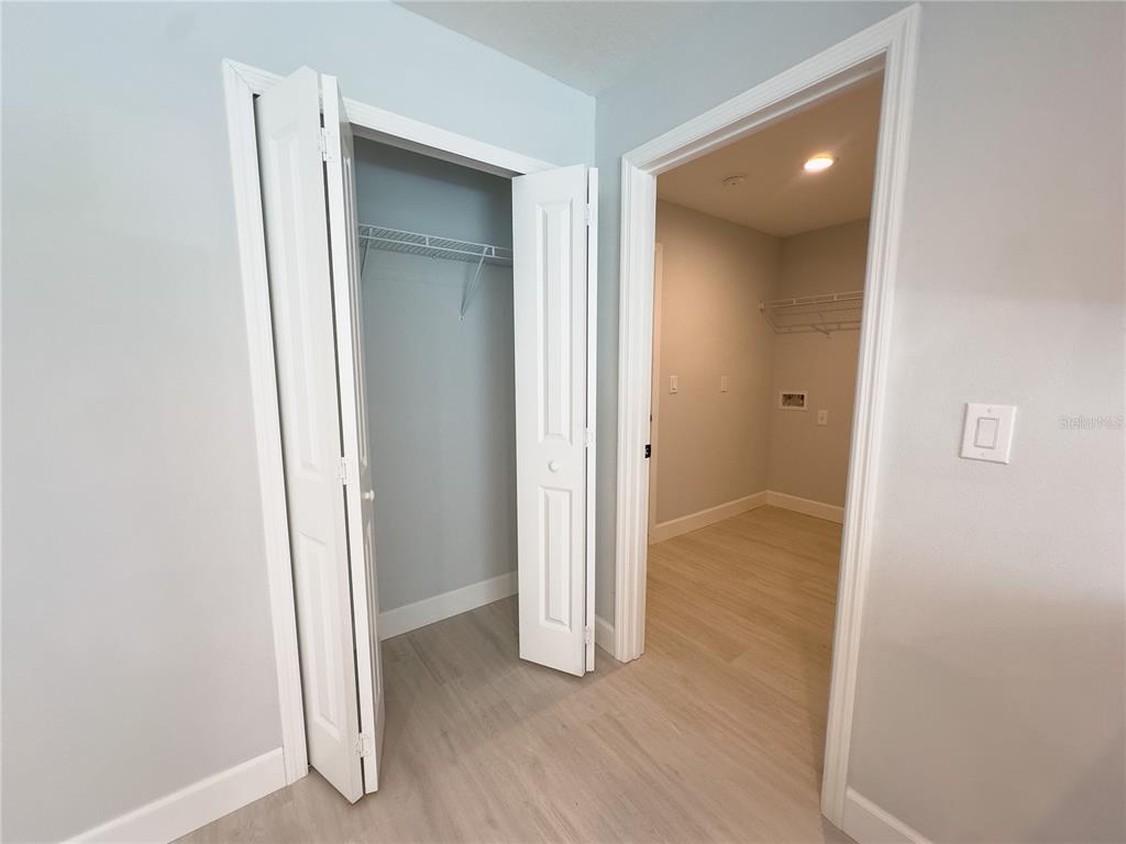 3602 Gillot Boulevard Port Charlotte, FL 33981 - Photo 24 of 28 an empty room with wooden floor and entrance