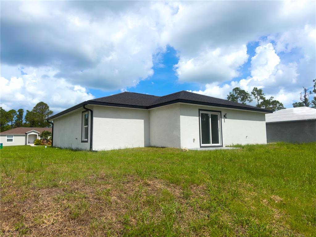 3602 Gillot Boulevard Port Charlotte, FL 33981 - Photo 3 of 28 a view of a house with a yard