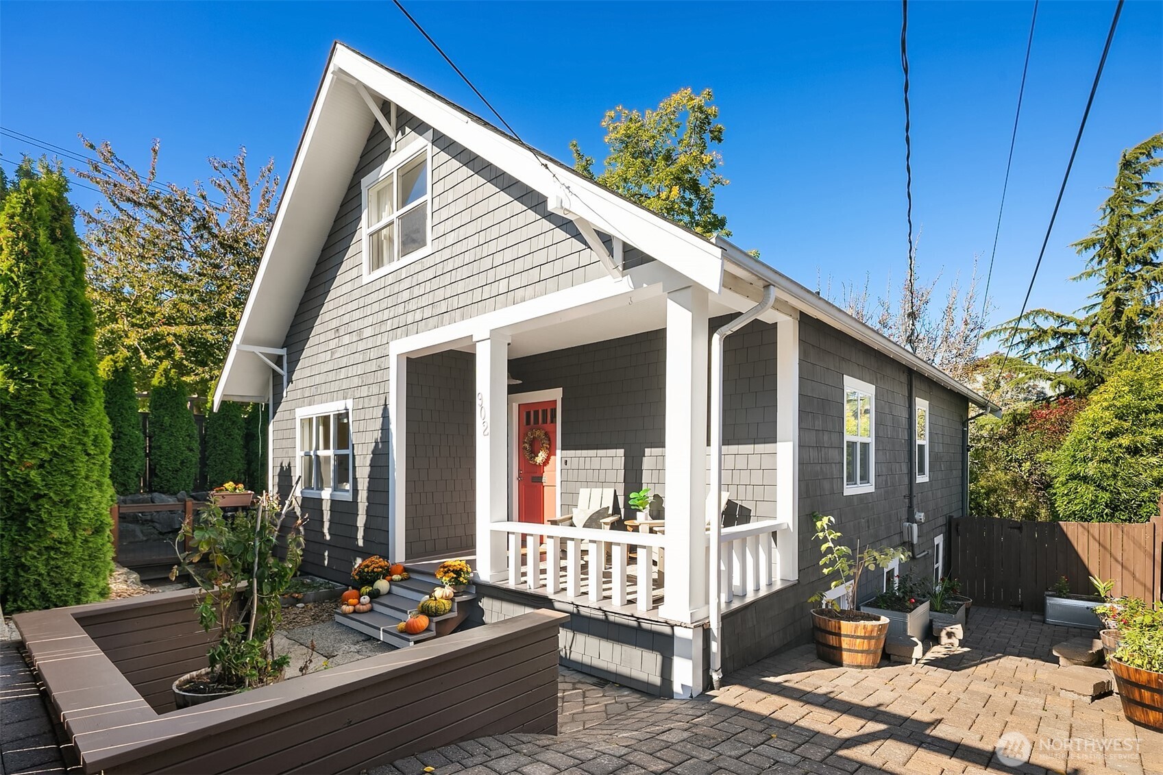 a view of a house with a chairs in patio
