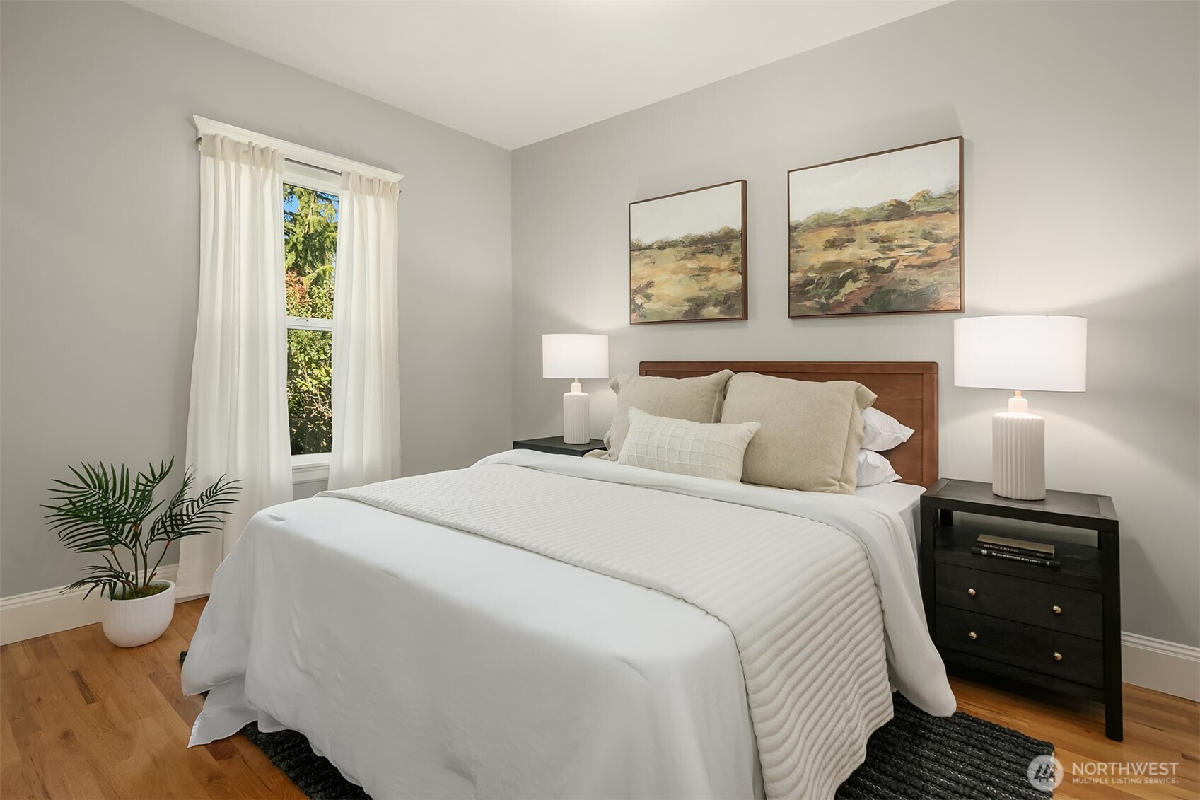 902 North 93rd Street Seattle, WA 98103 - Photo 11 of 34 a bedroom with a bed and a window