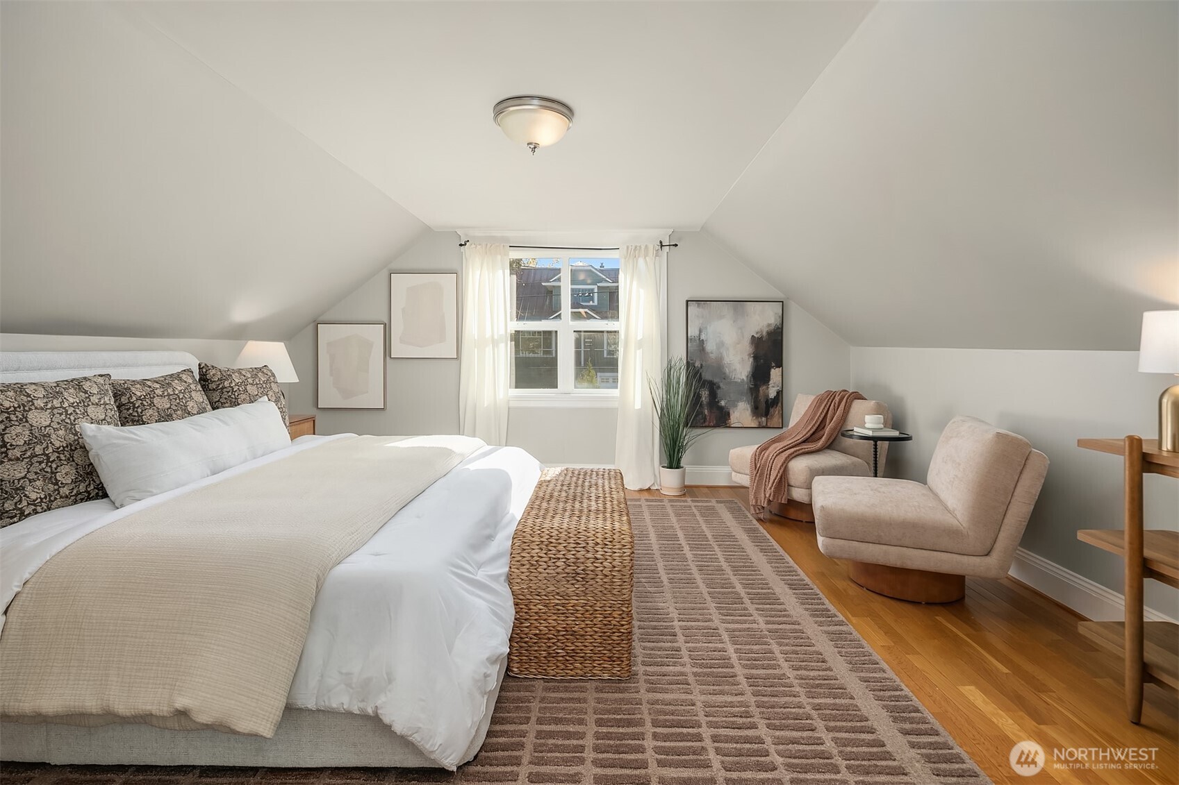 902 North 93rd Street Seattle, WA 98103 - Photo 14 of 34 a bedroom with a bed and wooden floor
