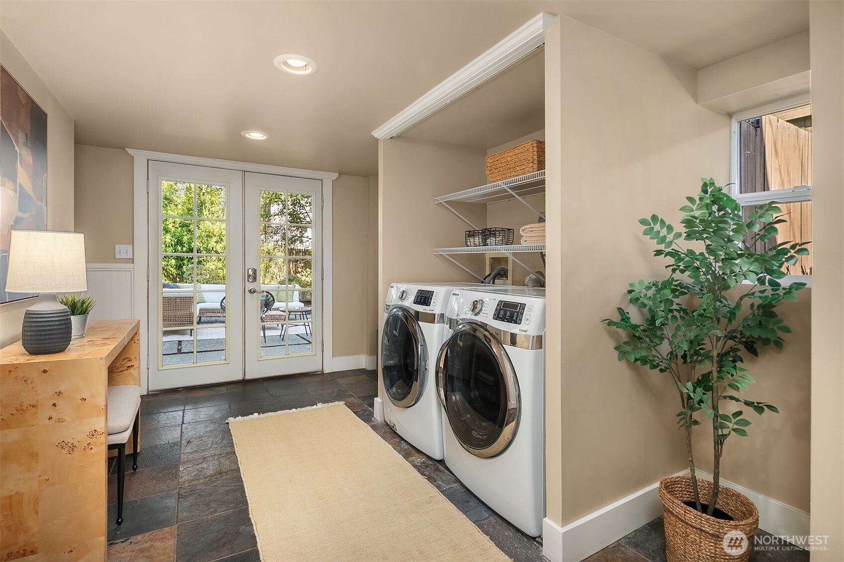 902 North 93rd Street Seattle, WA 98103 - Photo 18 of 34 a view of a bedroom with washer and dryer