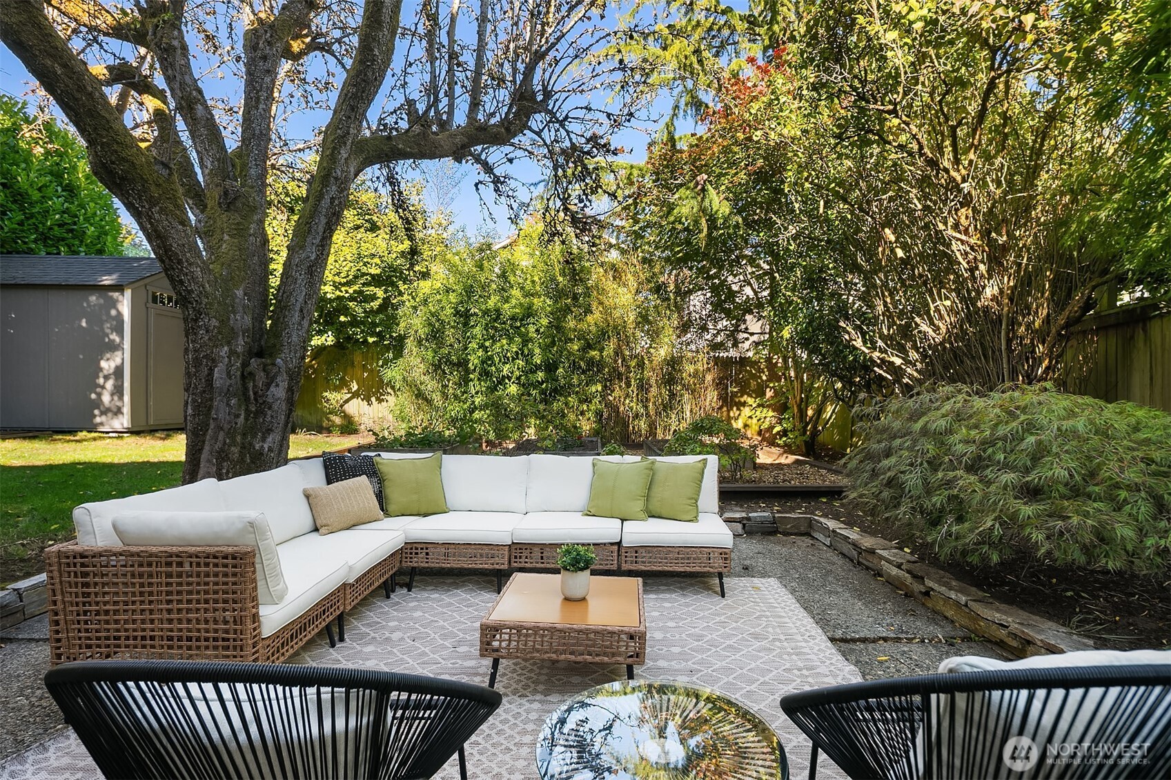 902 North 93rd Street Seattle, WA 98103 - Photo 29 of 34 a view of a couches in the patio with a small yard