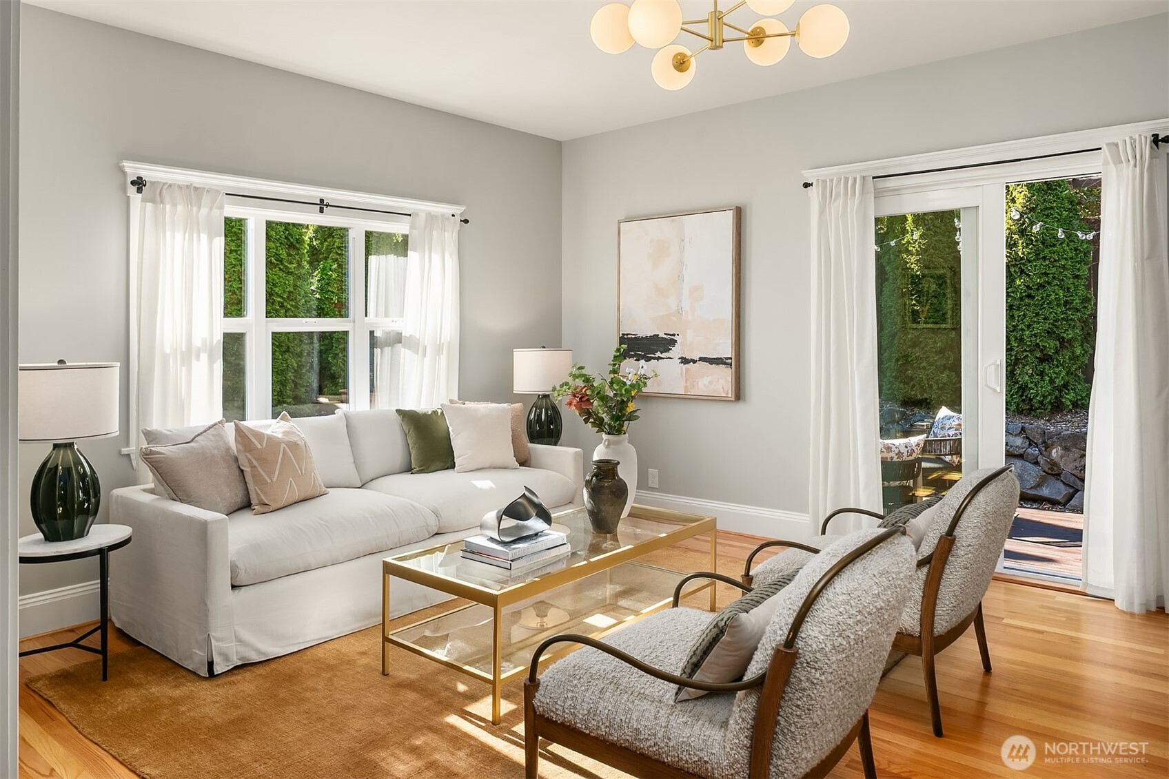 902 North 93rd Street Seattle, WA 98103 - Photo 4 of 34 a living room with furniture and floor to ceiling windows