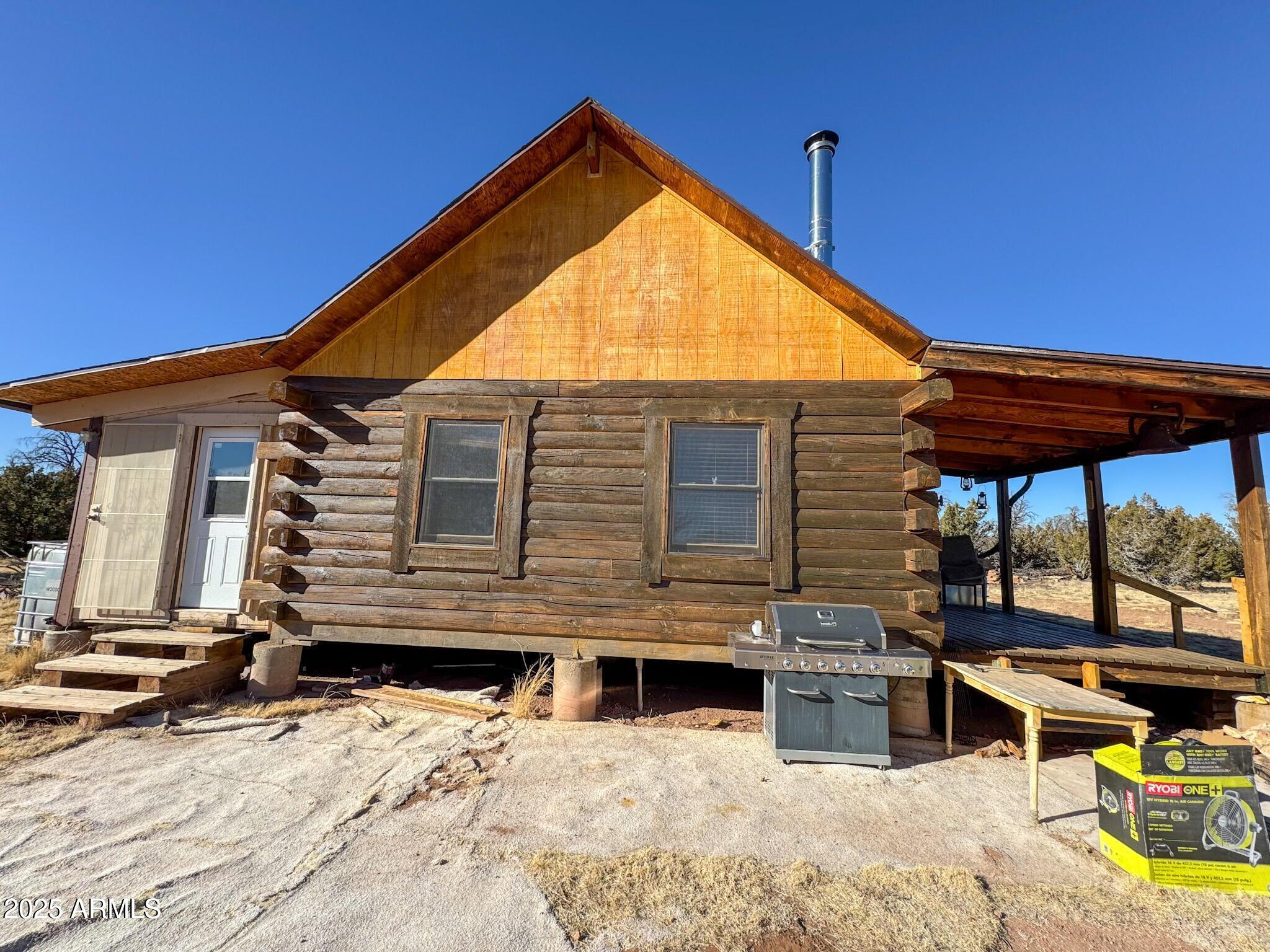 5823 Cattle Guard Road Williams, AZ 86046 - Photo 16 of 48 a view of a house with a patio