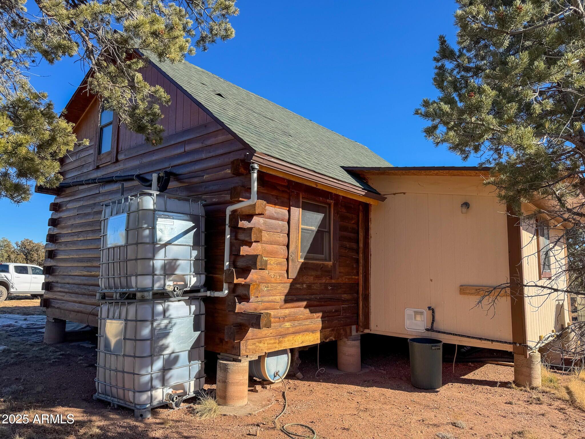 5823 Cattle Guard Road Williams, AZ 86046 - Photo 19 of 48 a front view of a house with outdoor seating