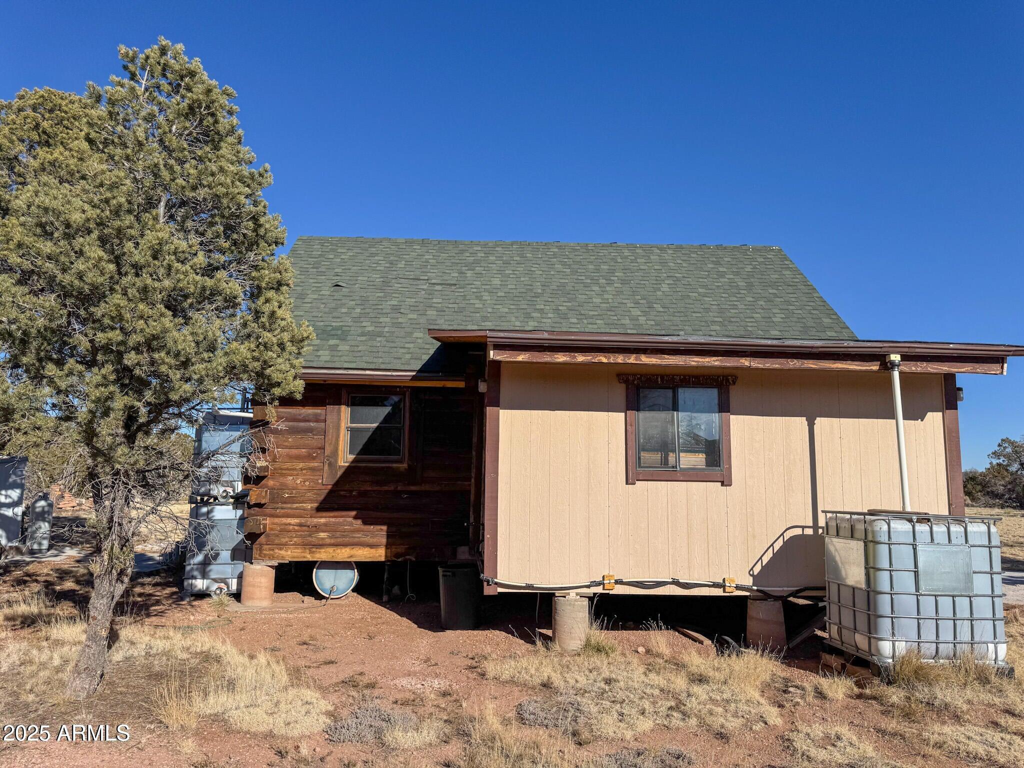 5823 Cattle Guard Road Williams, AZ 86046 - Photo 20 of 48 a front view of a house with a yard