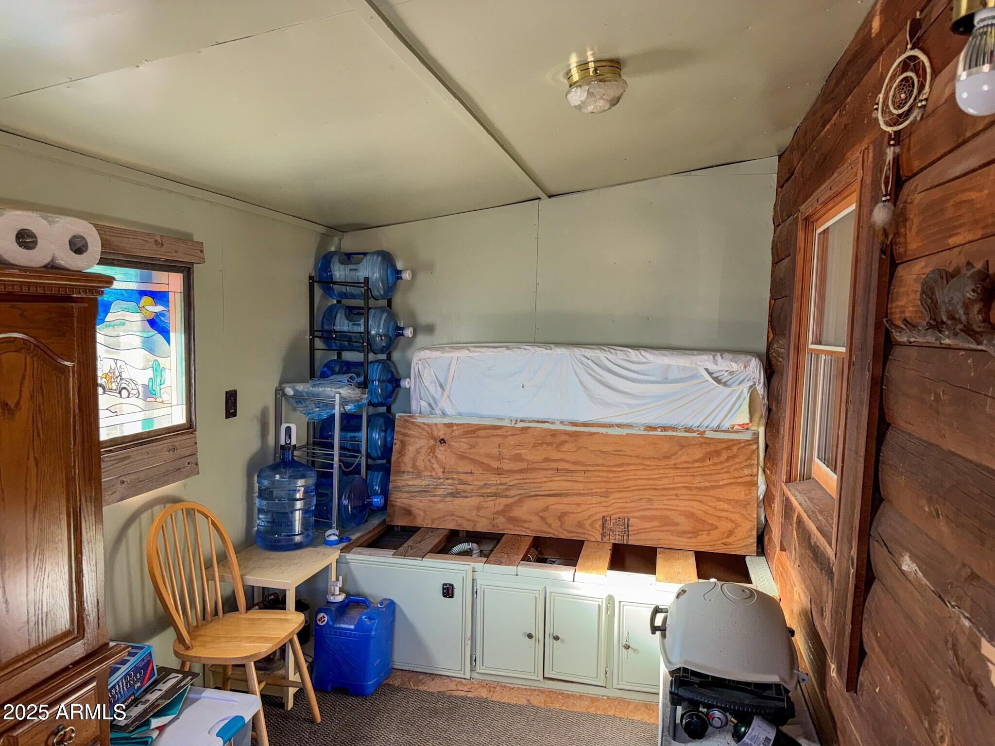 5823 Cattle Guard Road Williams, AZ 86046 - Photo 36 of 48 a bedroom with furniture and a window