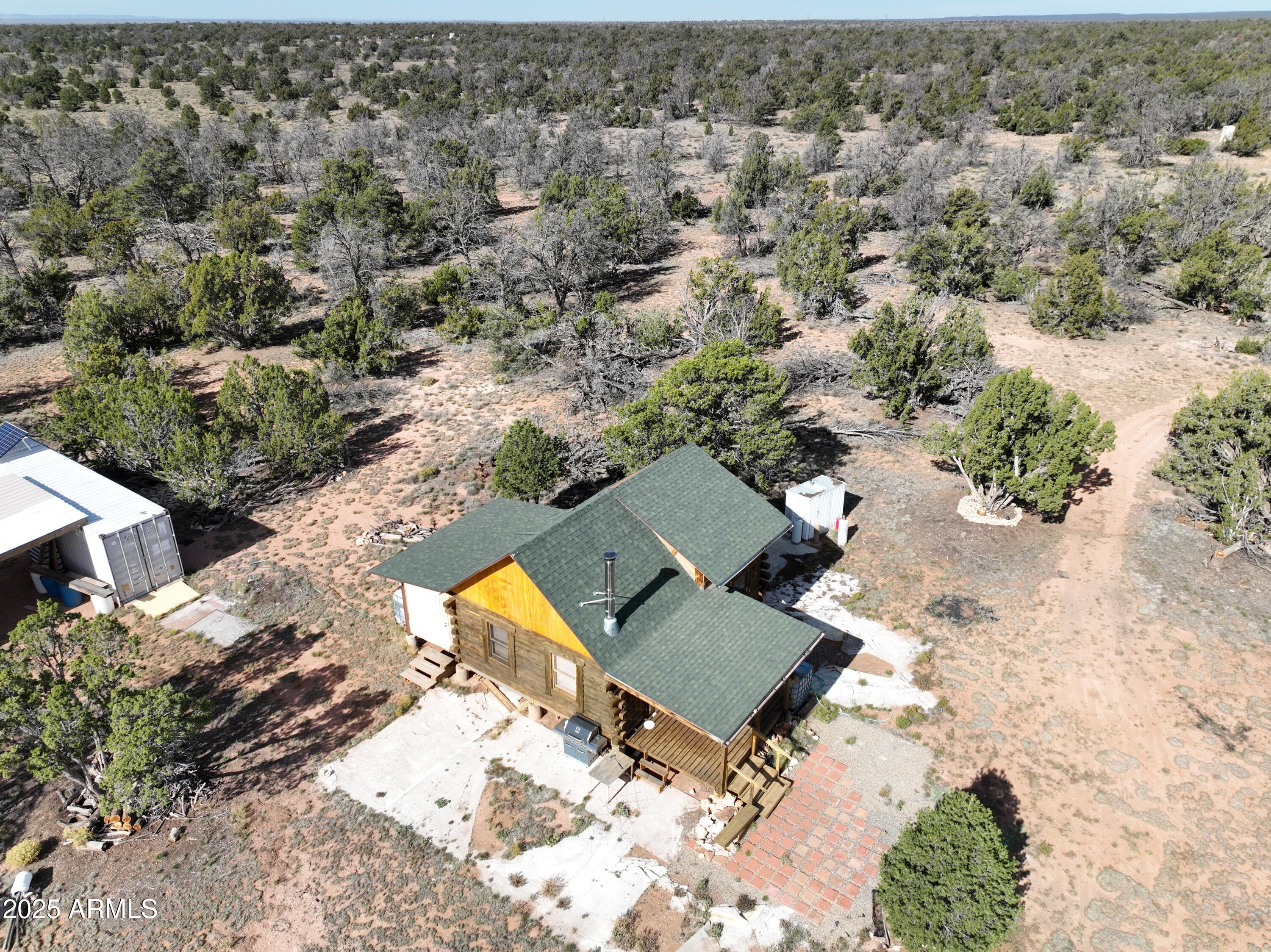 5823 Cattle Guard Road Williams, AZ 86046 - Photo 6 of 48 an aerial view of a house with a yard and trees