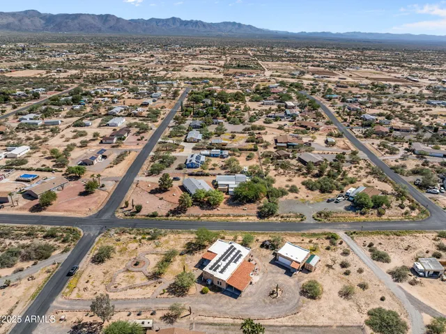 an aerial view of residential building and parking space