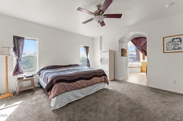 a spacious bathroom with a bathtub sink and mirror