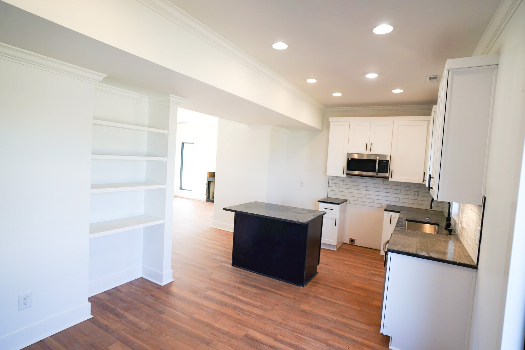 943 Overlook Trail Stewart, TN 37175 - Photo 15 of 35 a large living room with stainless steel appliances wooden floor and large window