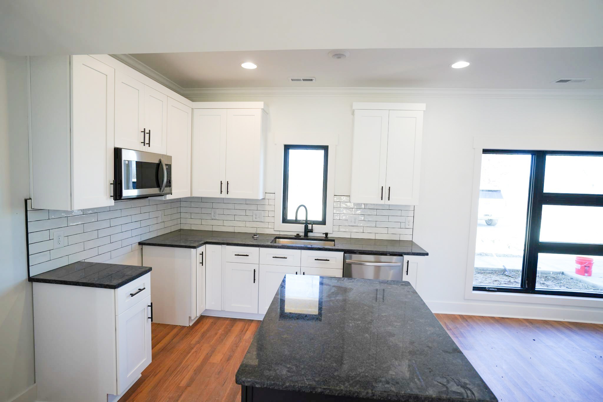 943 Overlook Trail Stewart, TN 37175 - Photo 16 of 35 a kitchen with granite countertop a stove and a sink