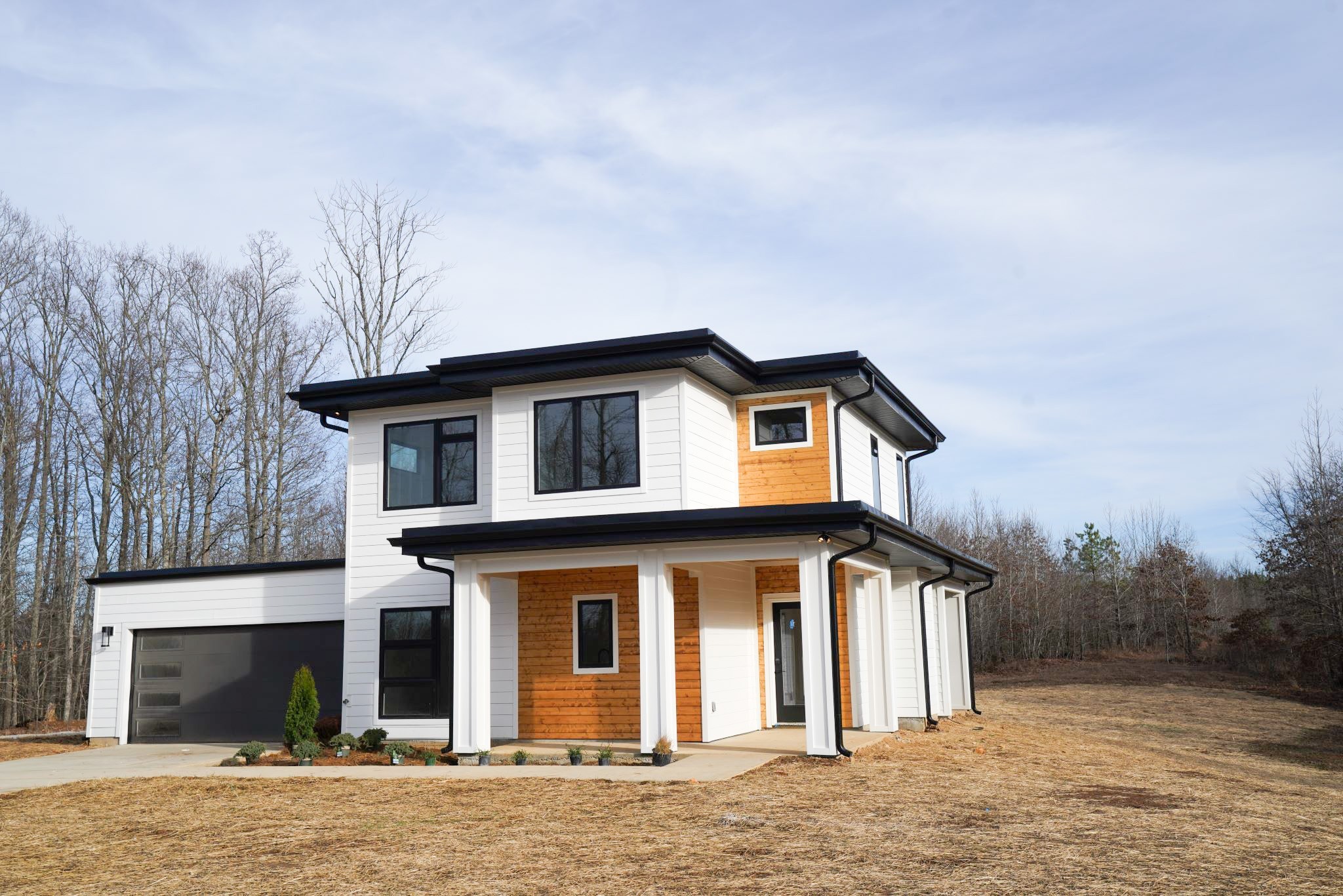 943 Overlook Trail Stewart, TN 37175 - Photo 2 of 35 a front view of a house with a yard and garage