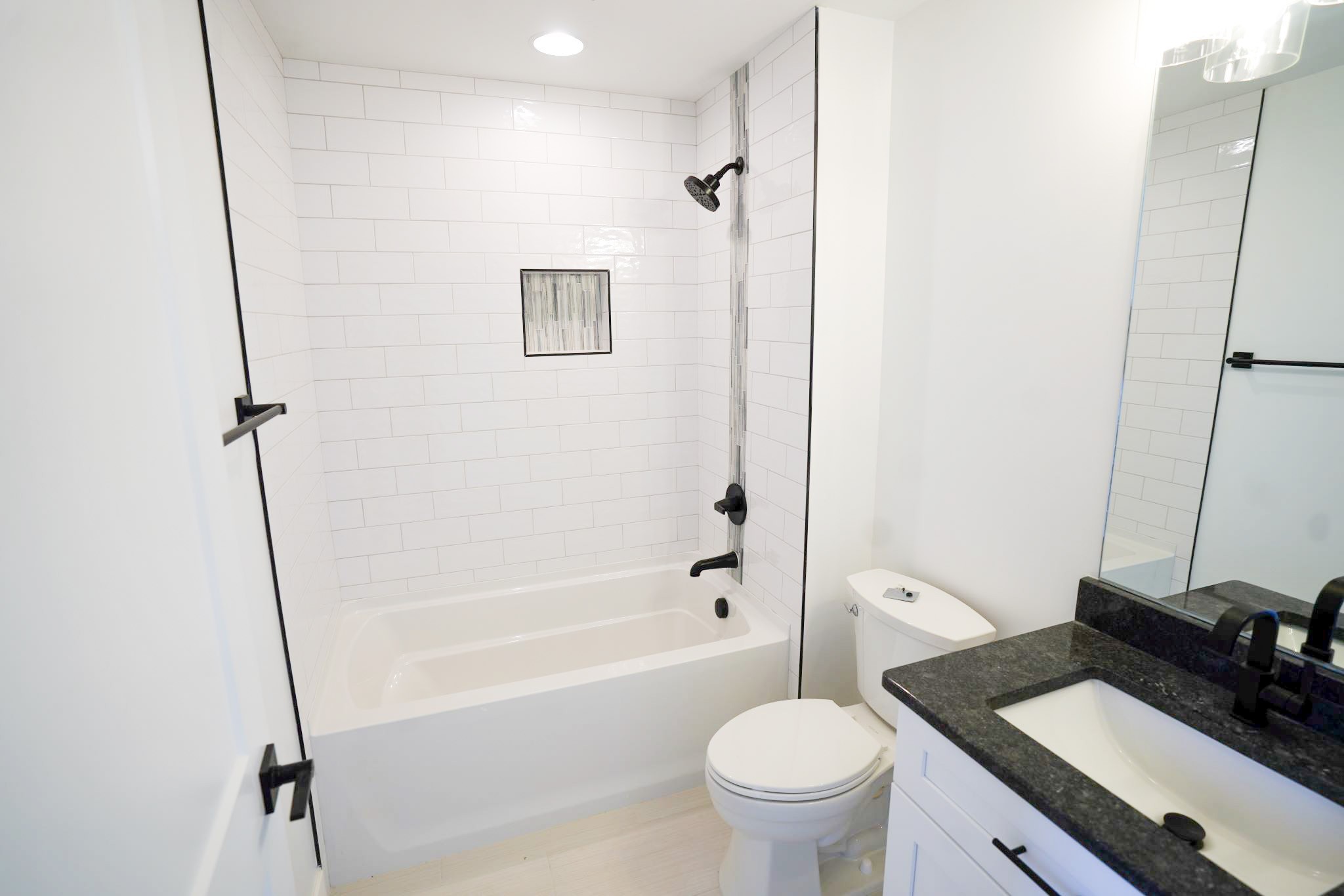 943 Overlook Trail Stewart, TN 37175 - Photo 24 of 35 a bathroom with a sink toilet vanity and shower