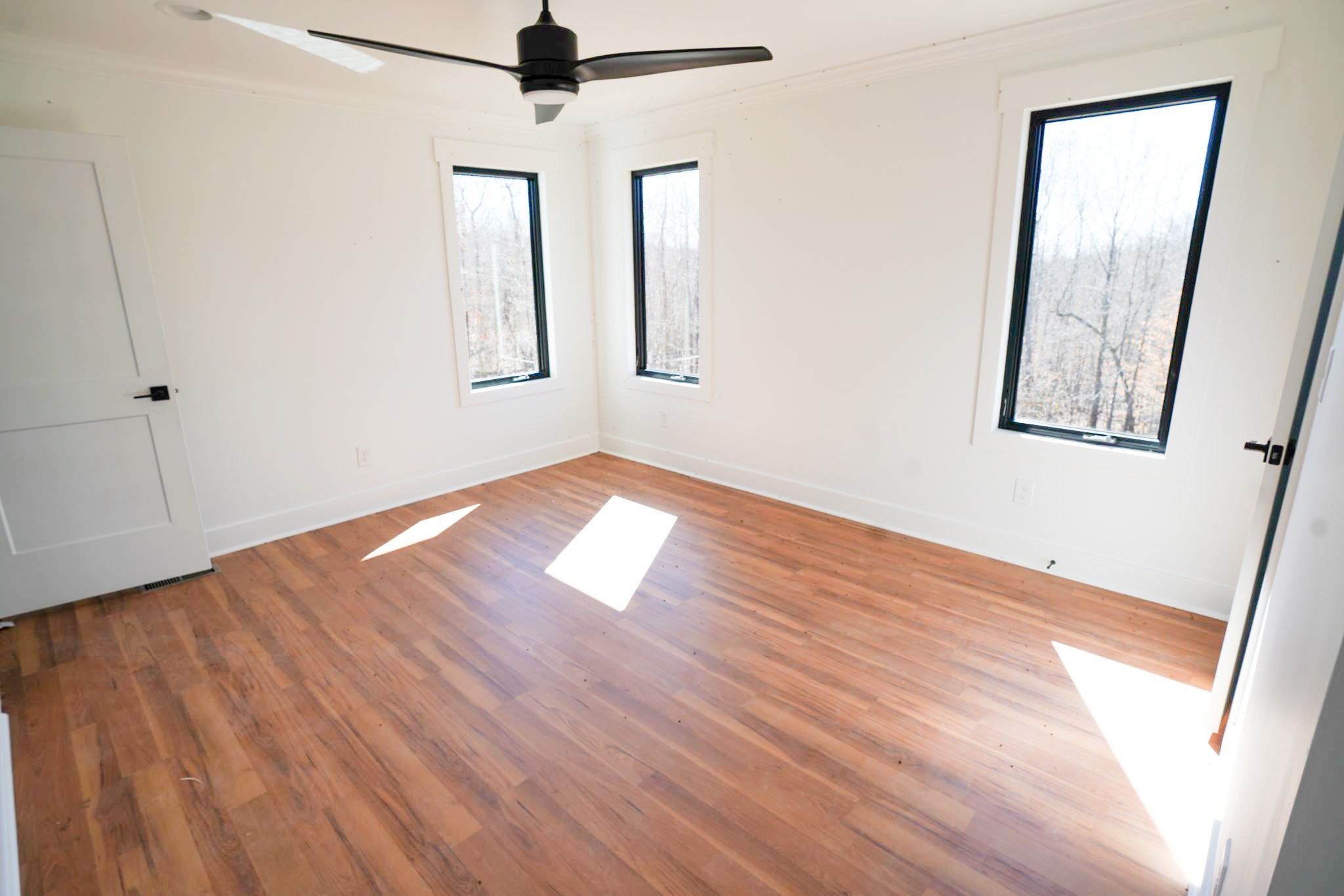 943 Overlook Trail Stewart, TN 37175 - Photo 26 of 35 a view of empty room with wooden floor and fan