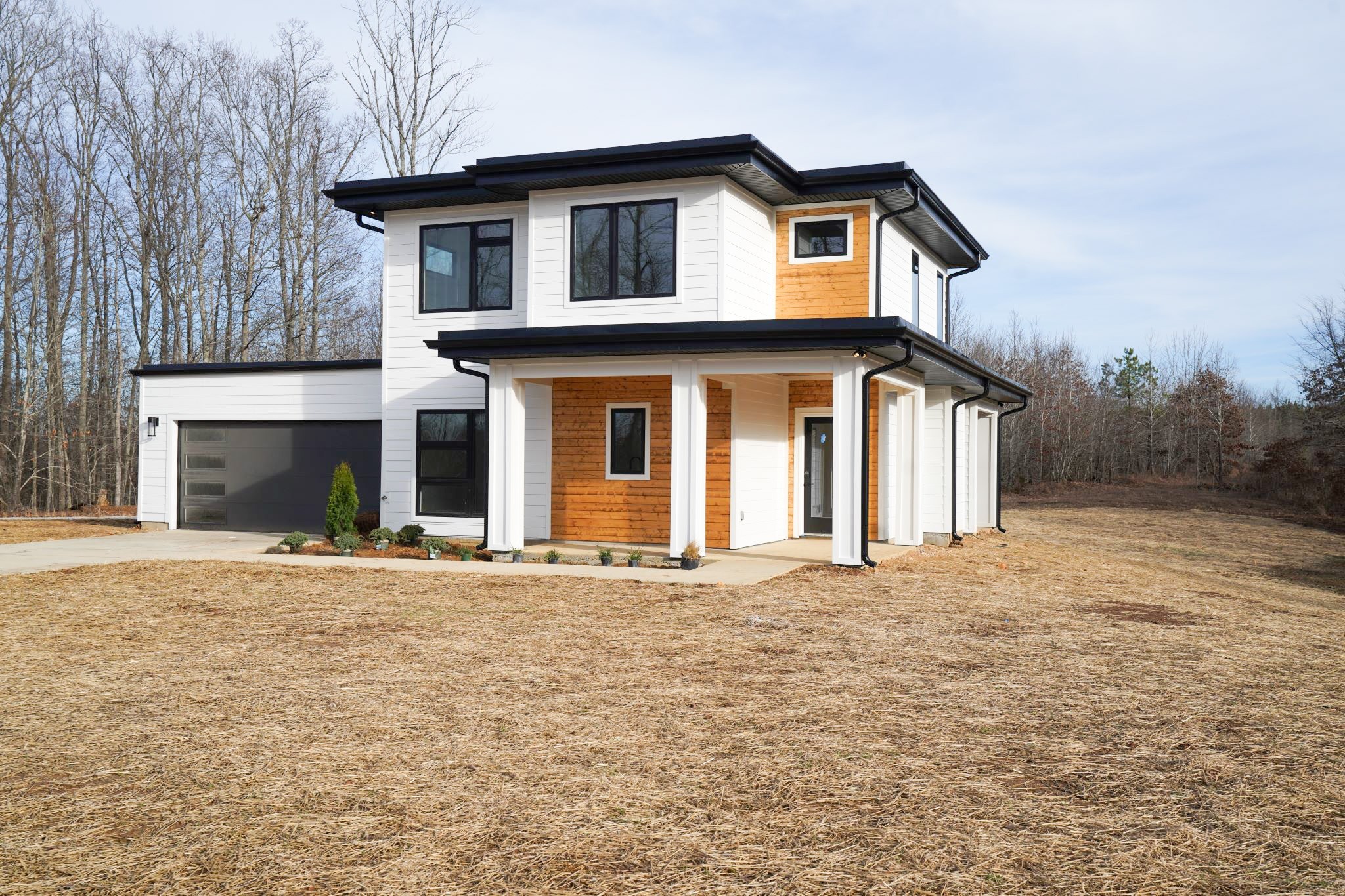 943 Overlook Trail Stewart, TN 37175 - Photo 4 of 35 a front view of a house with a yard and garage