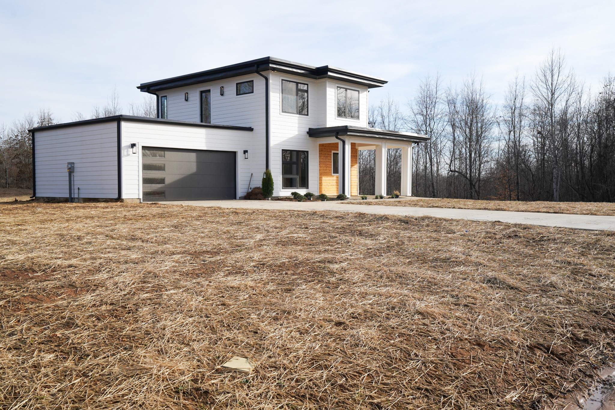 943 Overlook Trail Stewart, TN 37175 - Photo 6 of 35 a front view of a house with a yard and garage