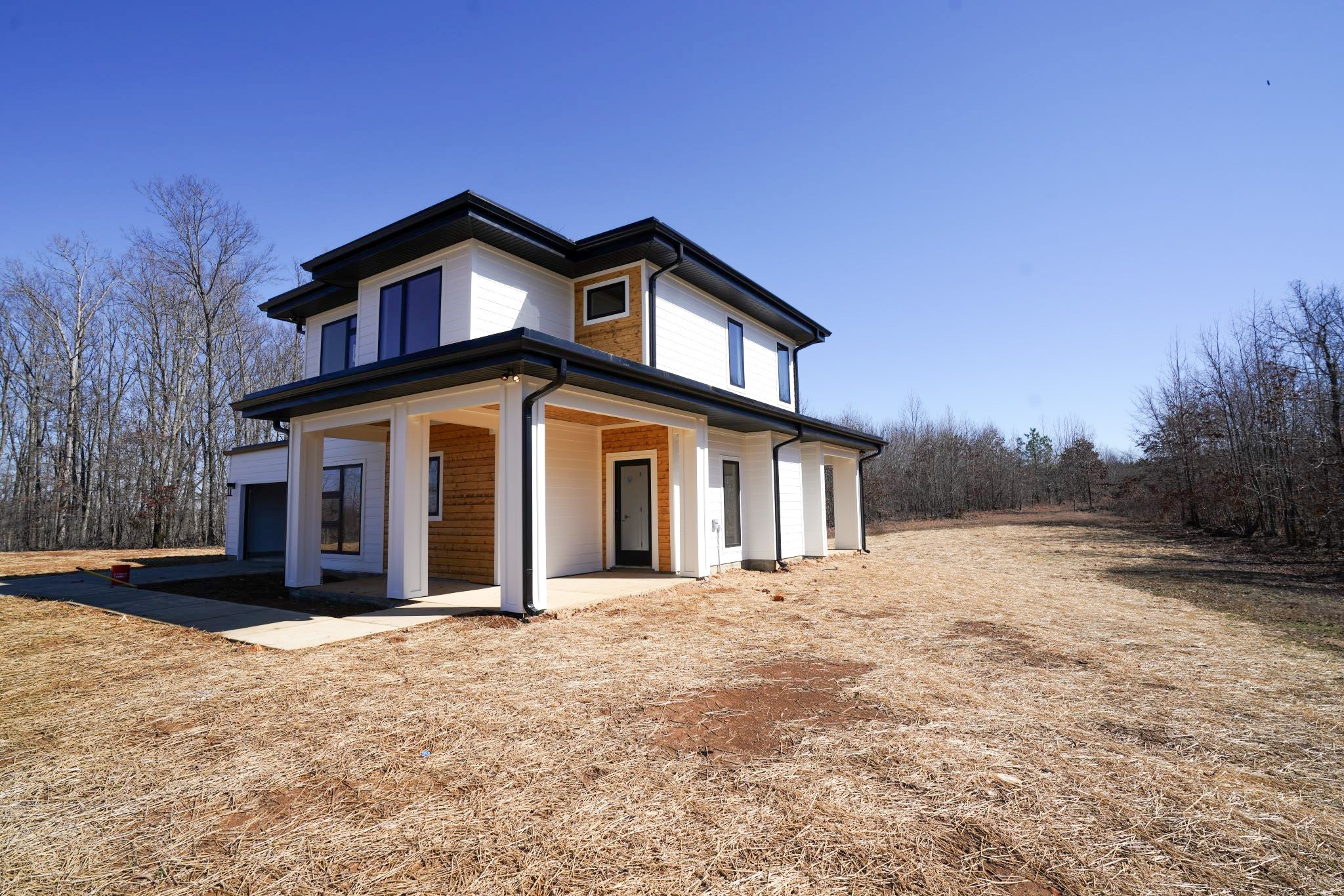 943 Overlook Trail Stewart, TN 37175 - Photo 7 of 35 a view of a house with a yard and garage