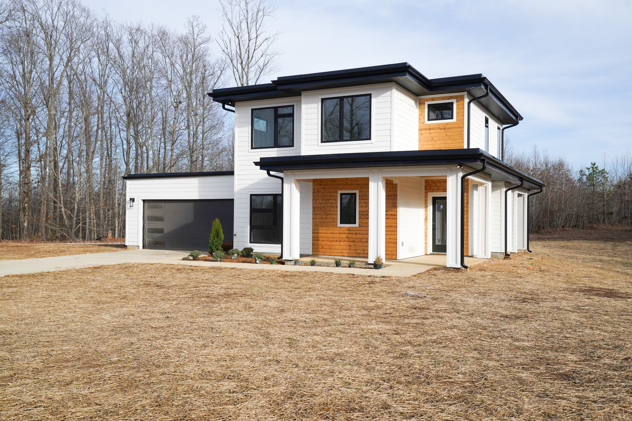 943 Overlook Trail Stewart, TN 37175 - Photo 8 of 35 a front view of a house with a yard and garage