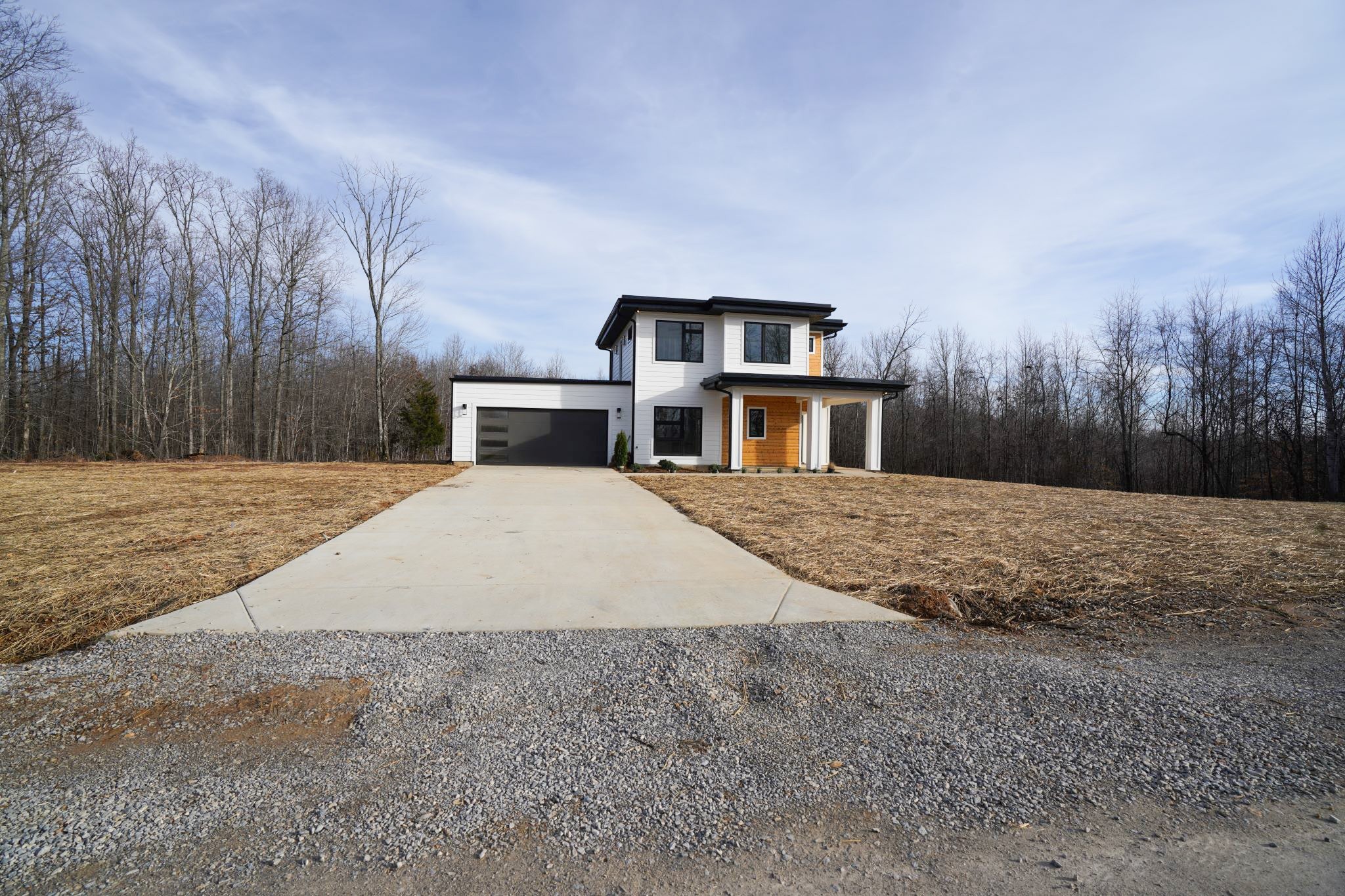 943 Overlook Trail Stewart, TN 37175 - Photo 9 of 35 a view of house with yard and trees in the background