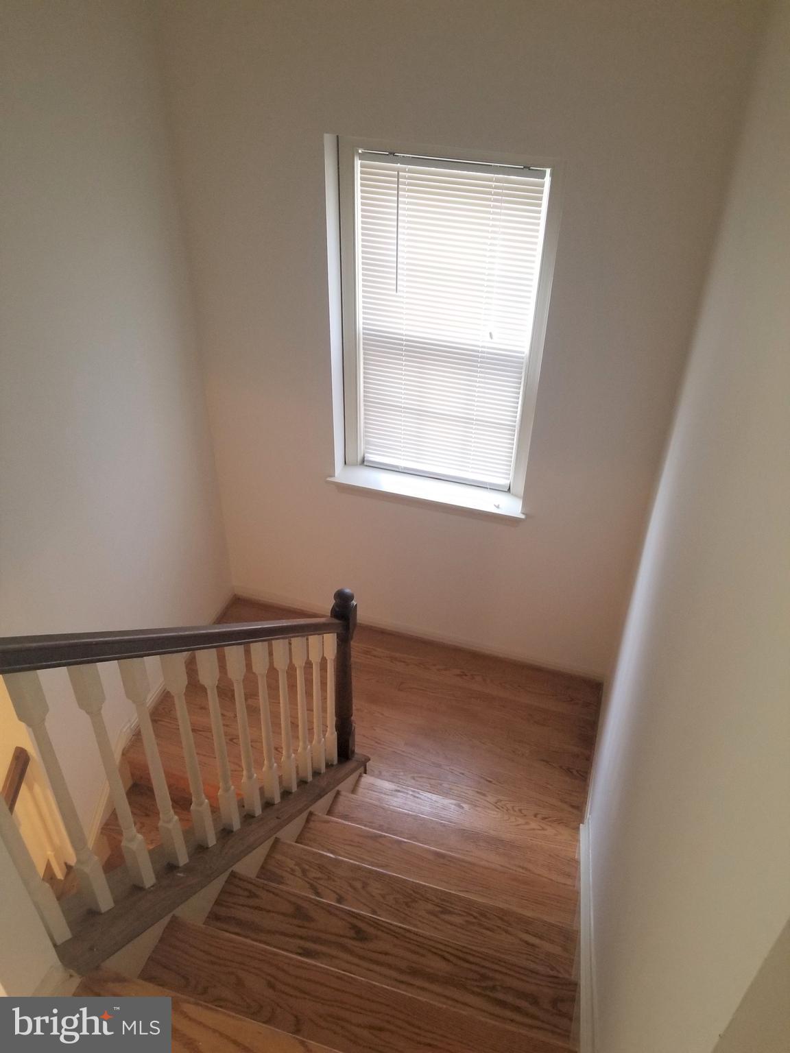 2229 Double Eagle Court Reston, VA 20191 - Photo 16 of 30 Light Filled Staircase with Hardwood Floors