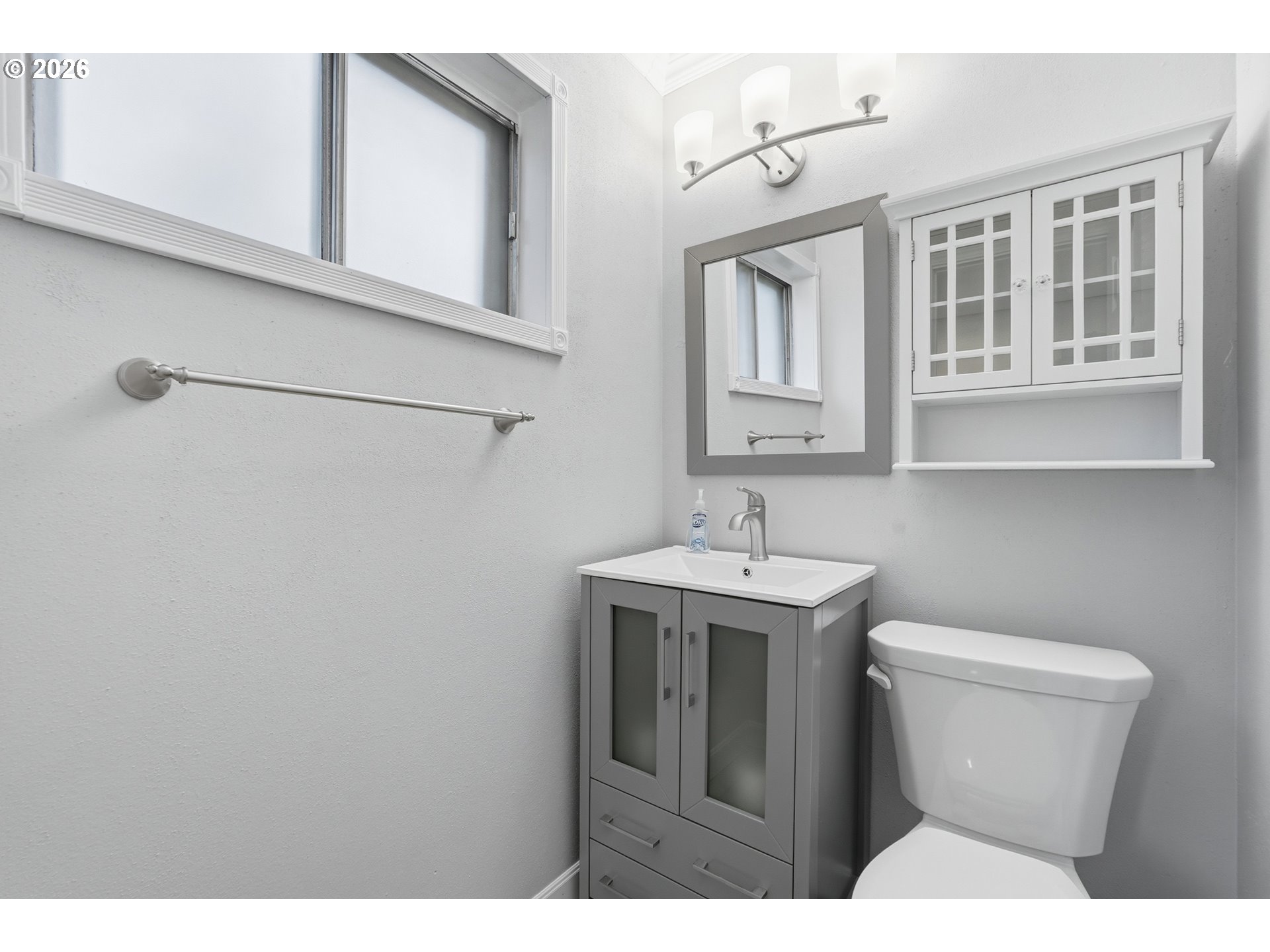 335 Southwest 141st Avenue Beaverton, OR 97006 - Photo 19 of 42 a bathroom with a toilet sink and mirror