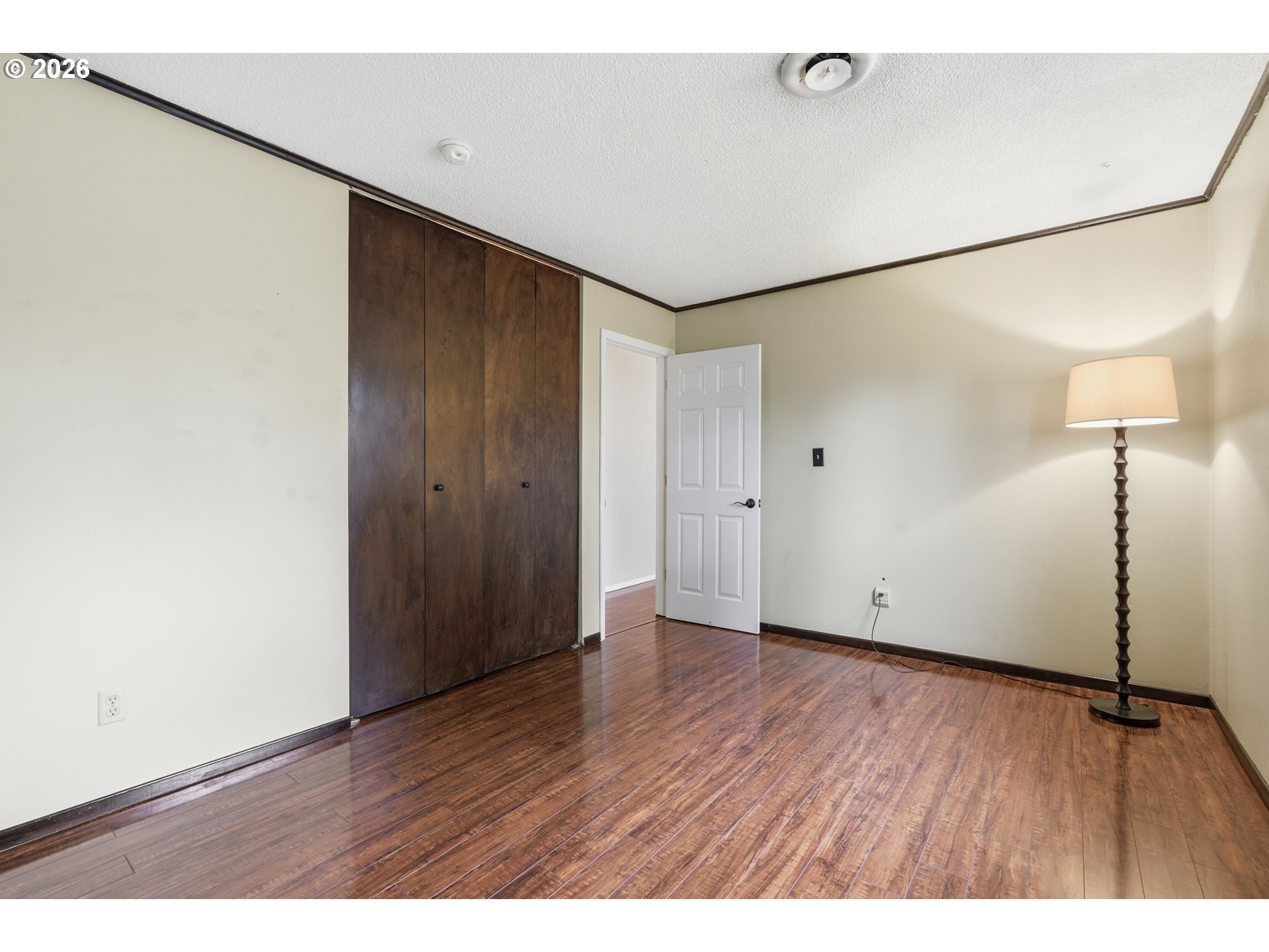 335 Southwest 141st Avenue Beaverton, OR 97006 - Photo 21 of 42 a view of an empty room with wooden floor