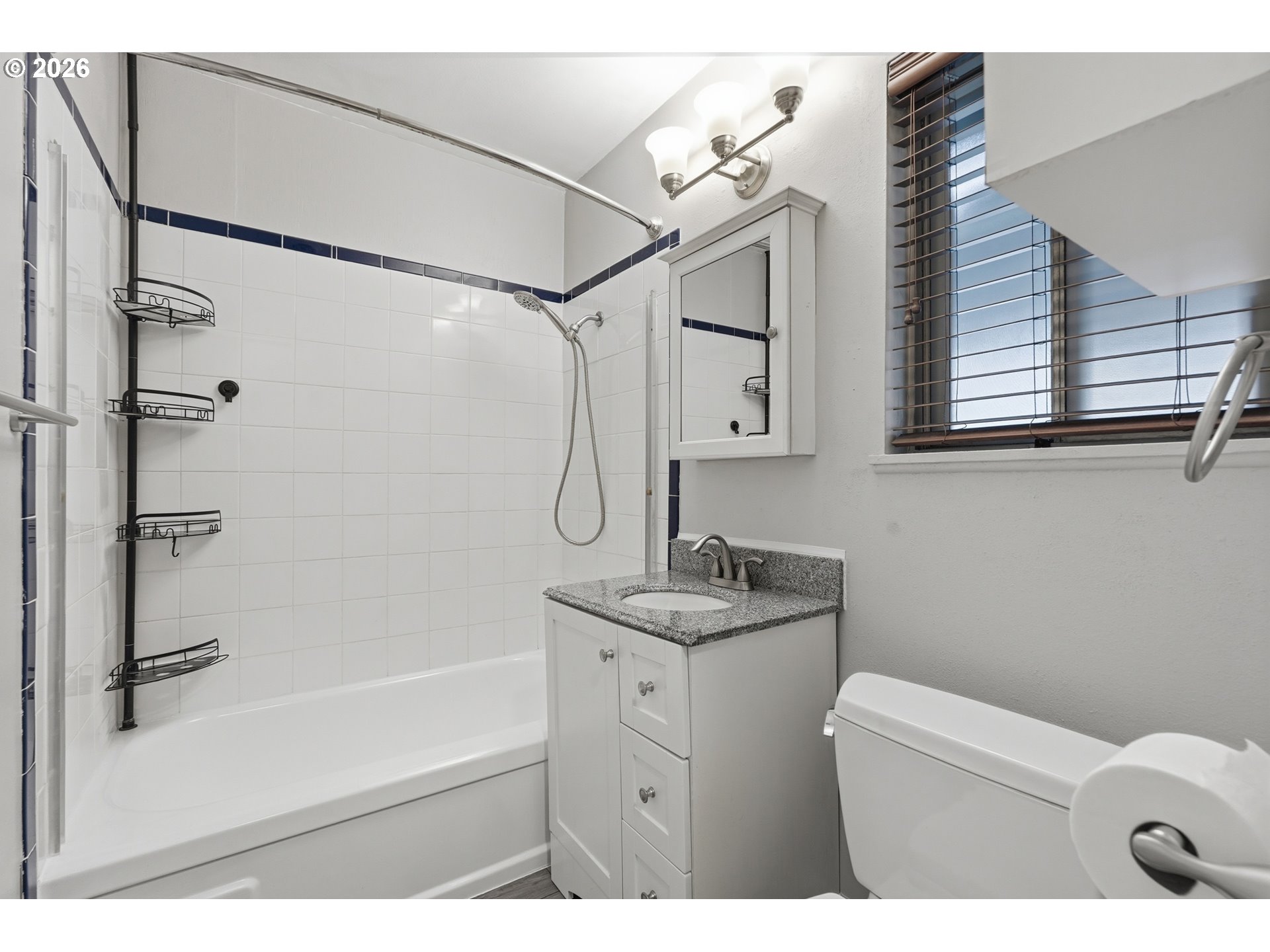 335 Southwest 141st Avenue Beaverton, OR 97006 - Photo 22 of 42 a bathroom with a granite countertop sink a toilet and shower