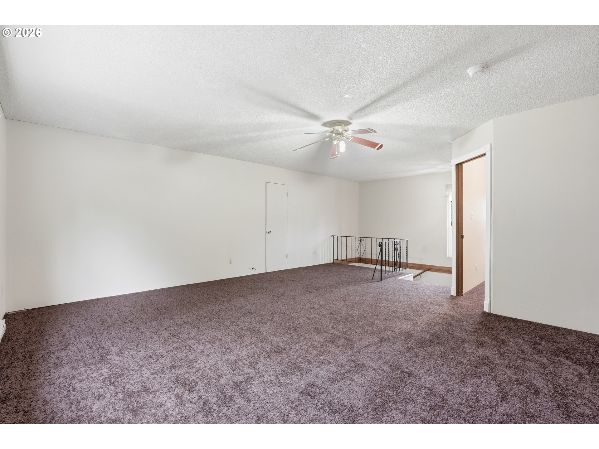 335 Southwest 141st Avenue Beaverton, OR 97006 - Photo 27 of 42 a view of an empty room and a ceiling fan