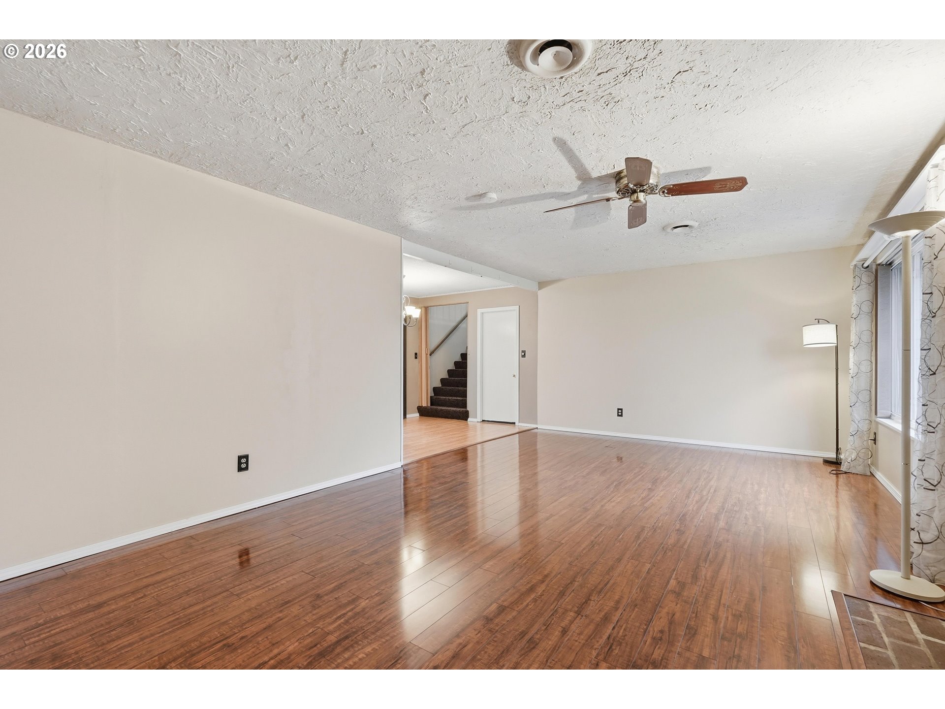 335 Southwest 141st Avenue Beaverton, OR 97006 - Photo 8 of 42 a view of a room with wooden floor
