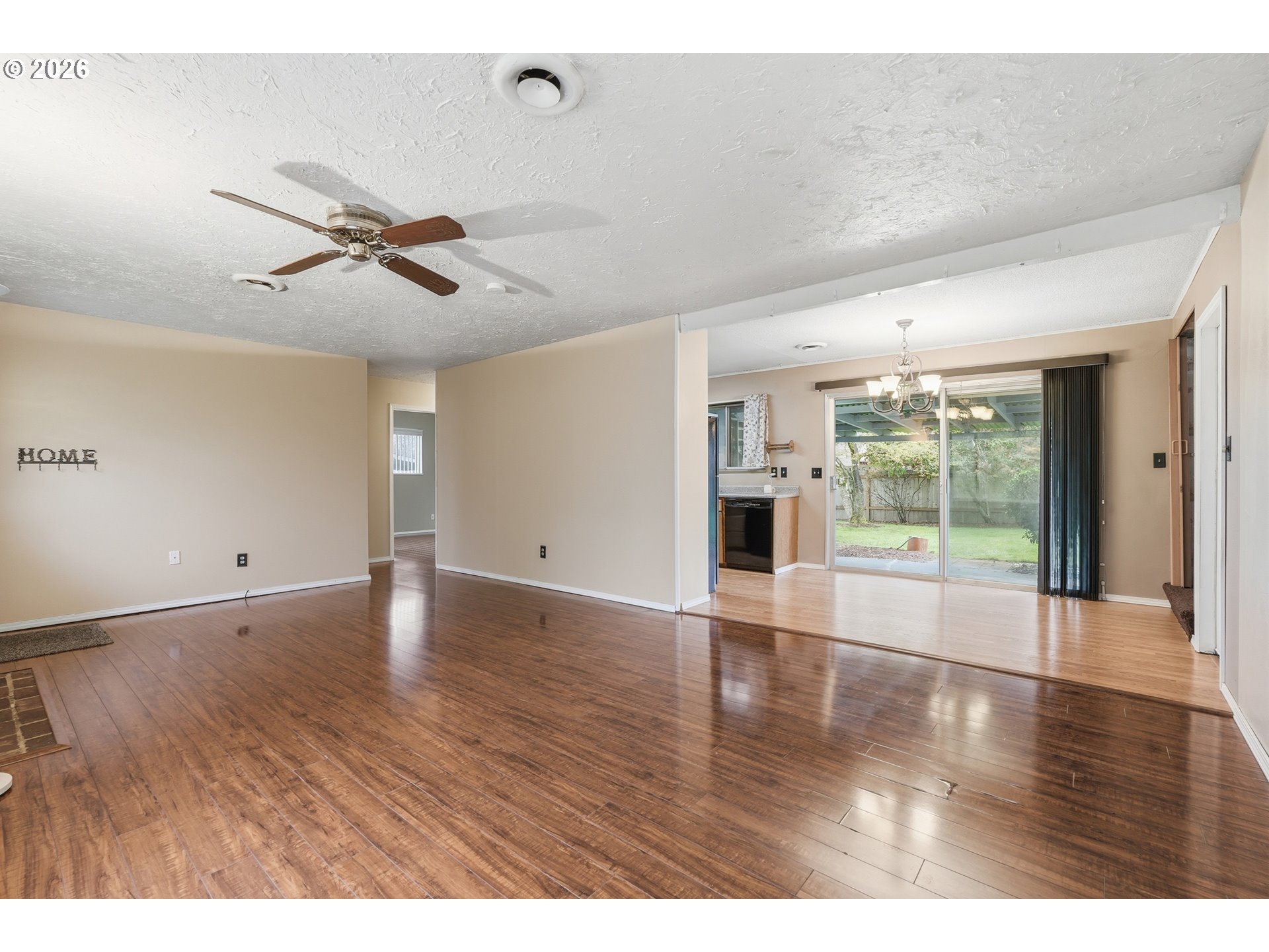335 Southwest 141st Avenue Beaverton, OR 97006 - Photo 9 of 42 a view of empty room with wooden floor and fan