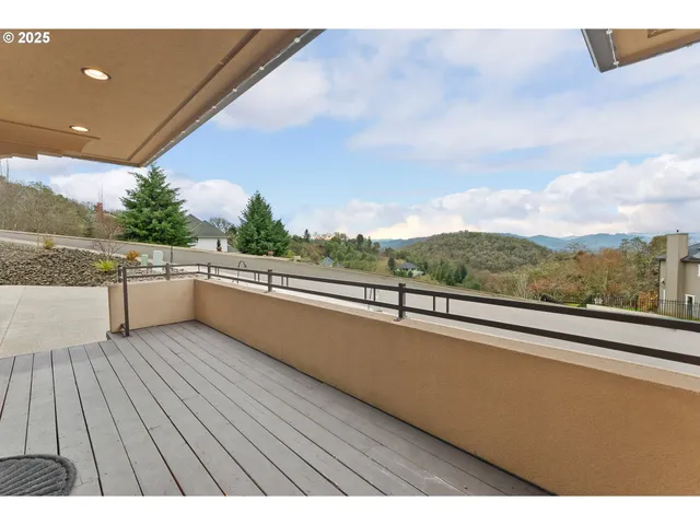 a view of roof deck with furniture