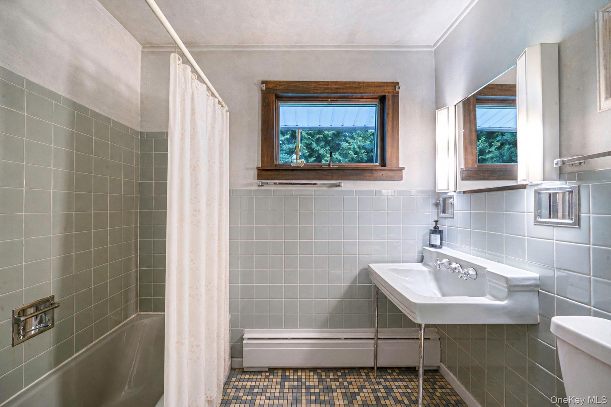 280 Deforest Road North Dix Hills, NY 11746 - Photo 23 of 37 a bathroom with a sink a toilet and shower