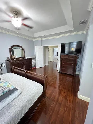 a bedroom with bed and window