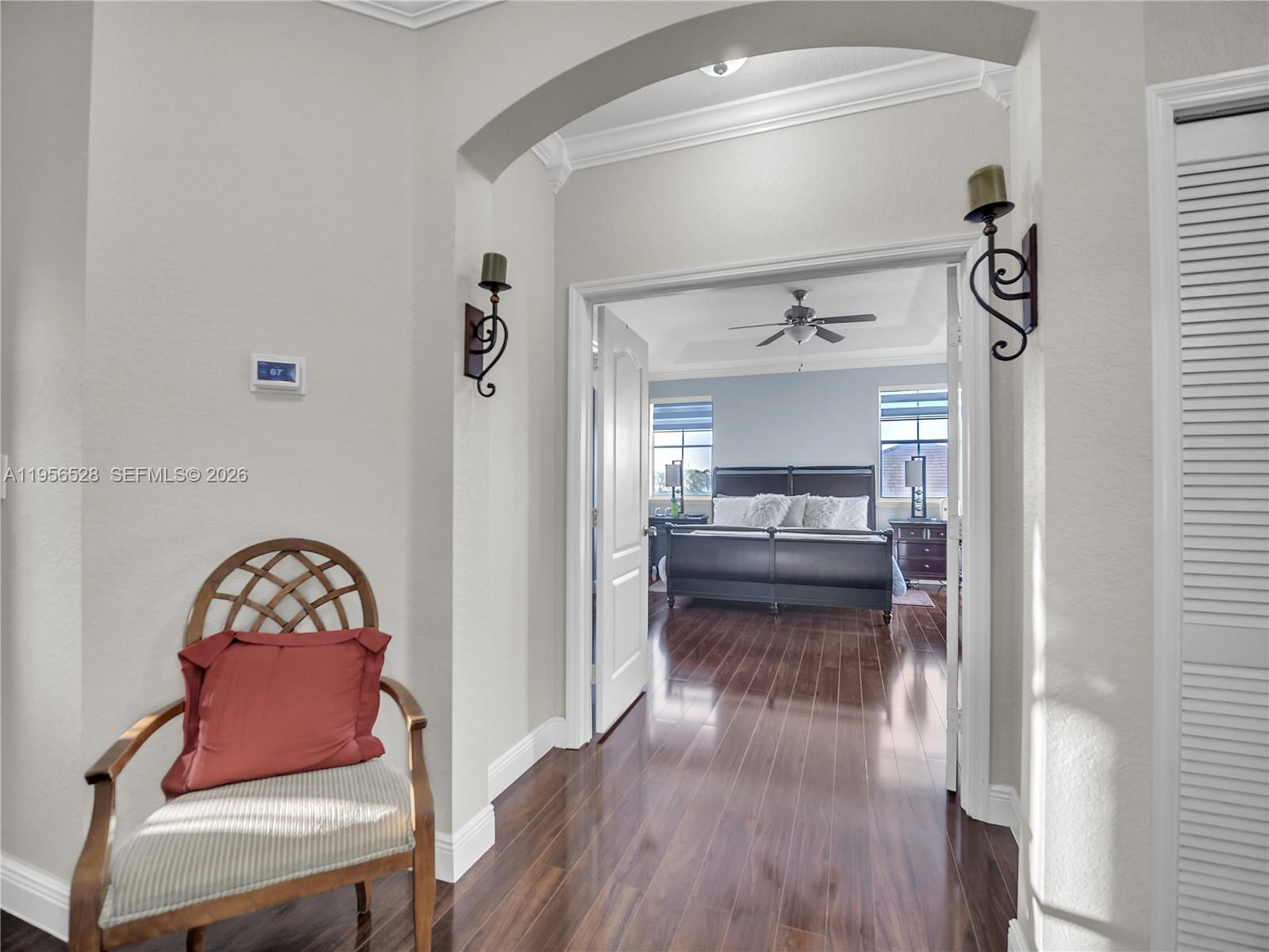 15541 Southwest 21st Terrace Miami, FL 33185 - Photo 16 of 34 a hallway with a dresser and a livingroom view