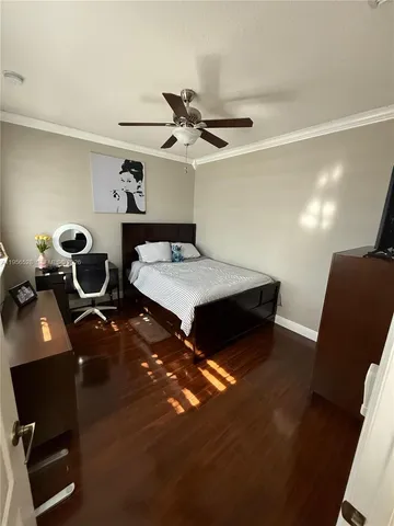 a living room with furniture and a piano