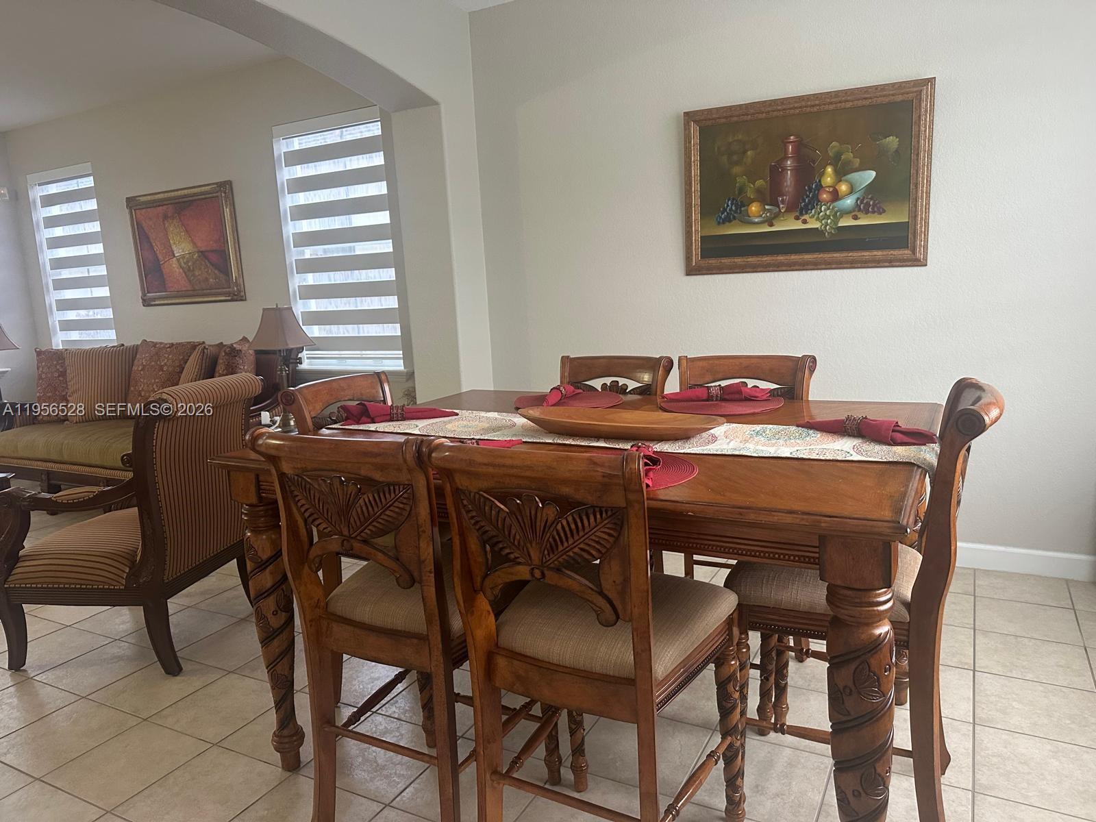 15541 Southwest 21st Terrace Miami, FL 33185 - Photo 19 of 21 a view of a dining room with furniture and window