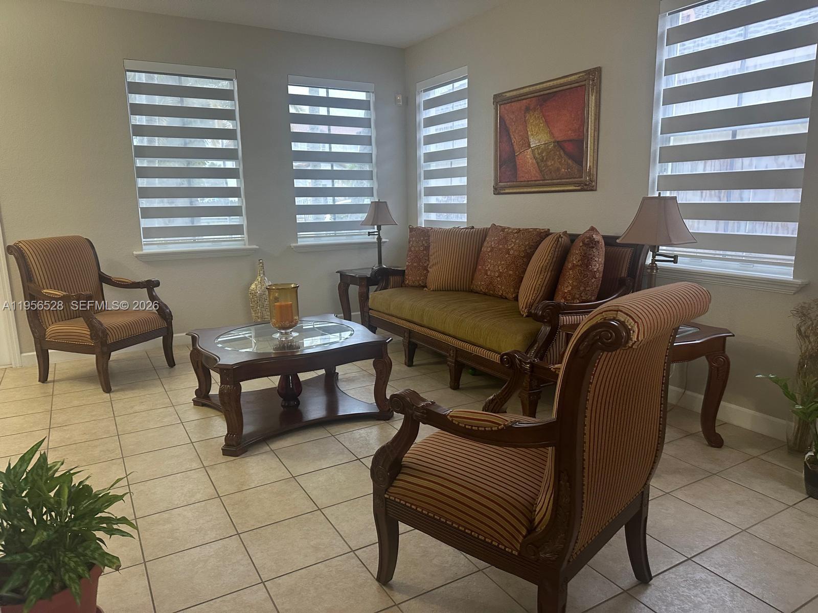 15541 Southwest 21st Terrace Miami, FL 33185 - Photo 20 of 21 a living room with furniture and a window