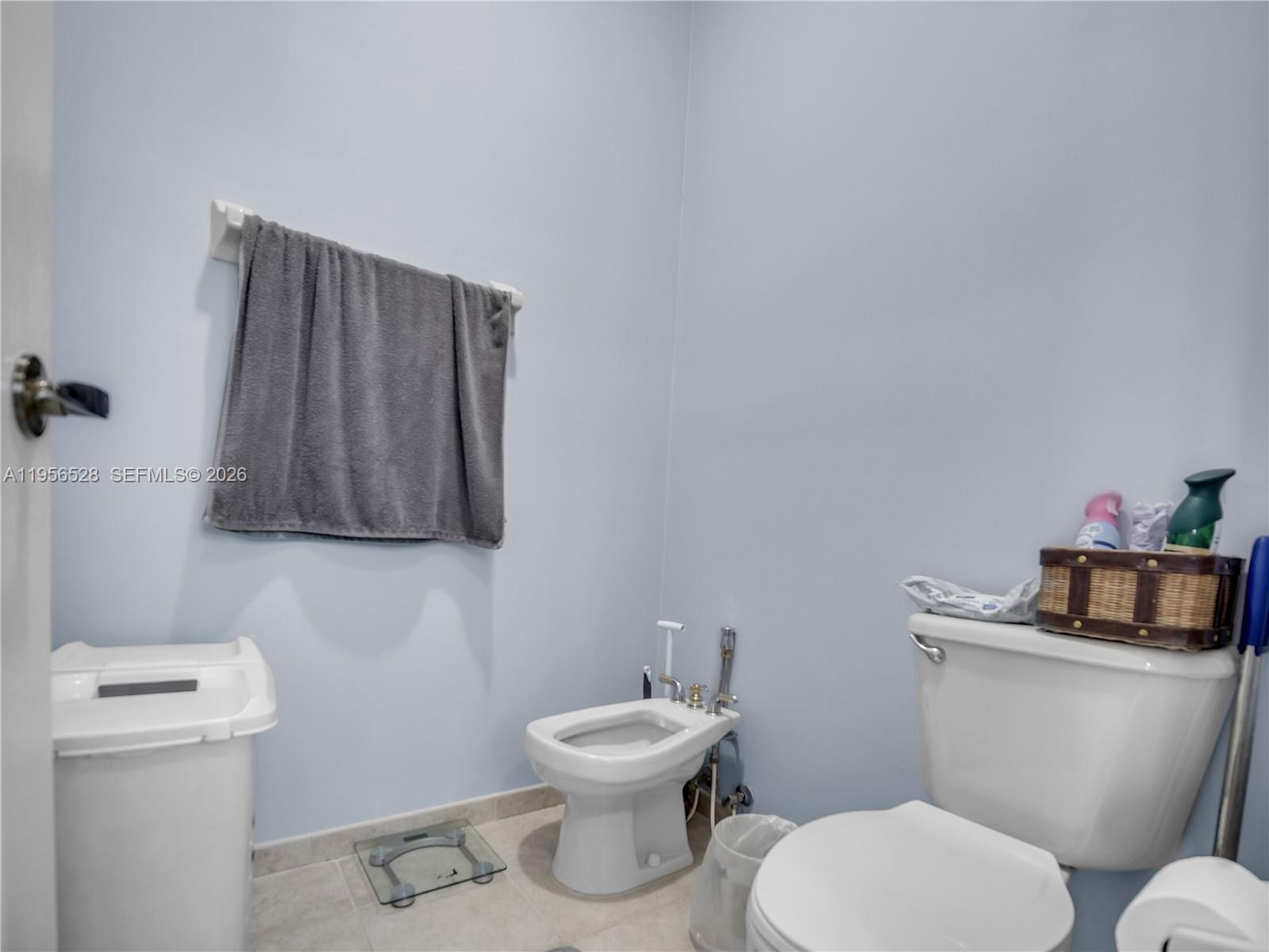 15541 Southwest 21st Terrace Miami, FL 33185 - Photo 21 of 34 a white toilet sitting next to a bathroom sink