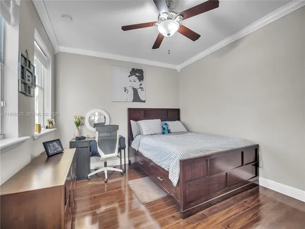a bedroom with a bed and a television