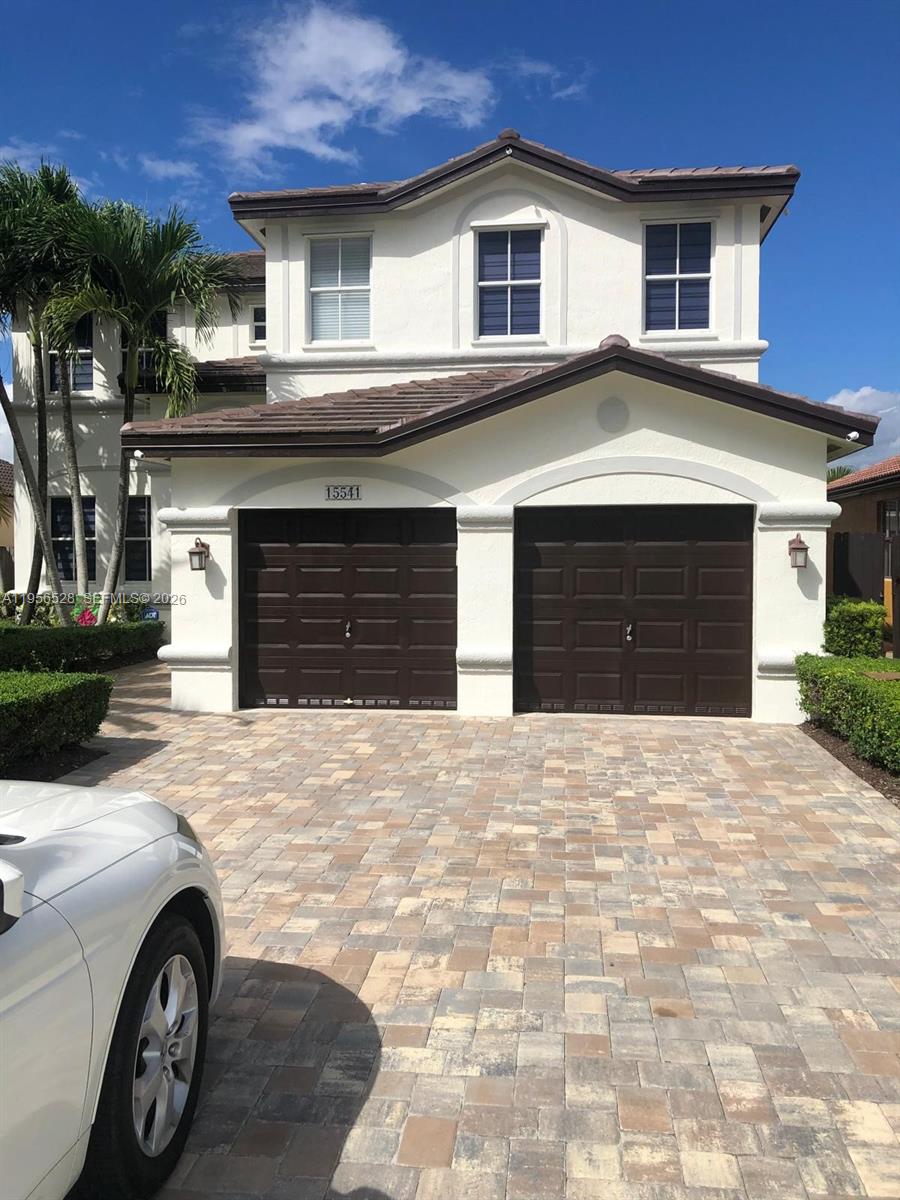 15541 Southwest 21st Terrace Miami, FL 33185 - Photo 5 of 21 a front view of a house with parking