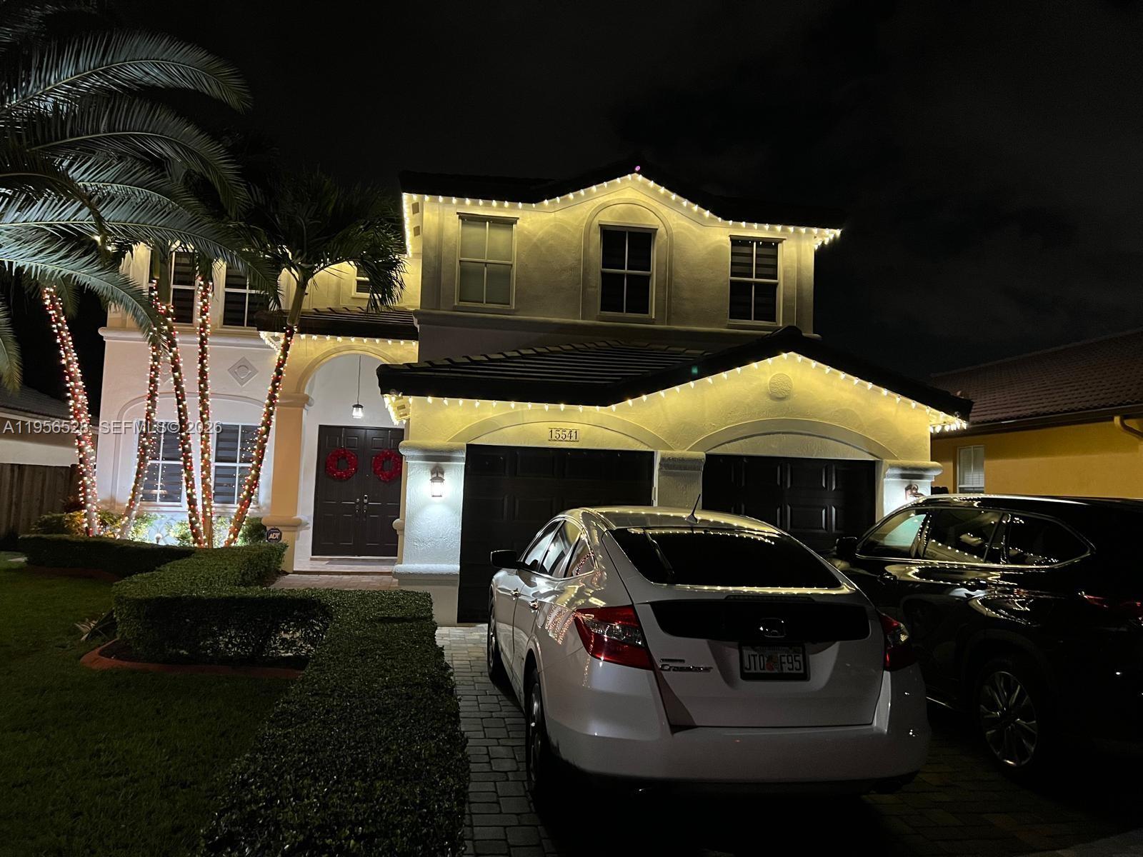15541 Southwest 21st Terrace Miami, FL 33185 - Photo 6 of 21 a front view of a house with yard fire pit and outdoor seating