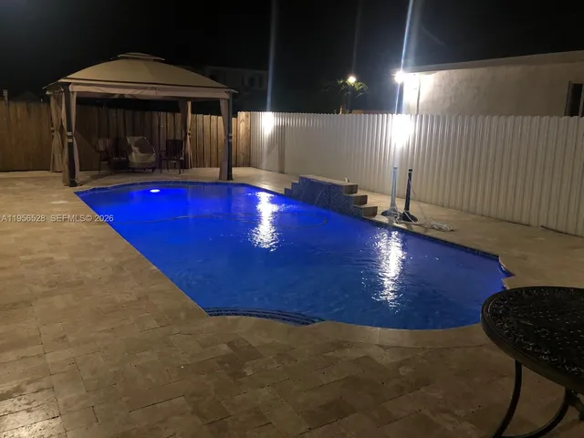 a view of a swimming pool with an outdoor space