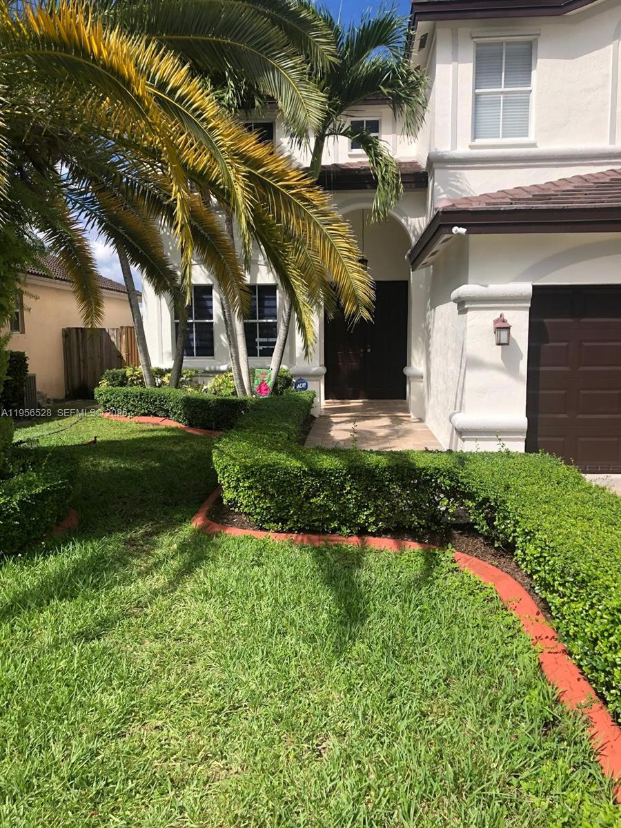 15541 Southwest 21st Terrace Miami, FL 33185 - Photo 8 of 21 a front view of a house with a yard
